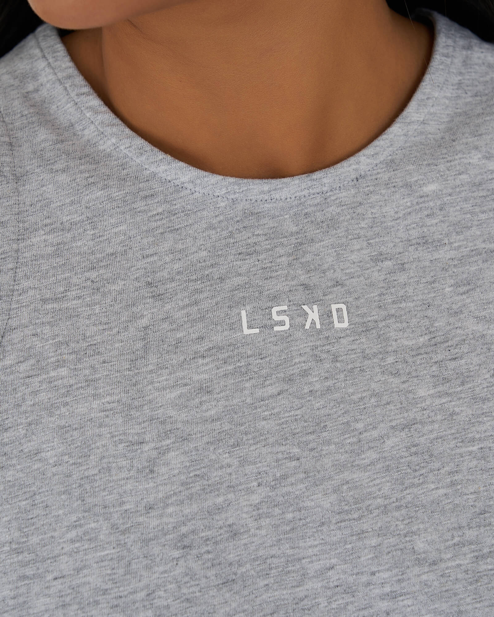 Model wearing Icon Crossover Tank - Lt Grey Marl