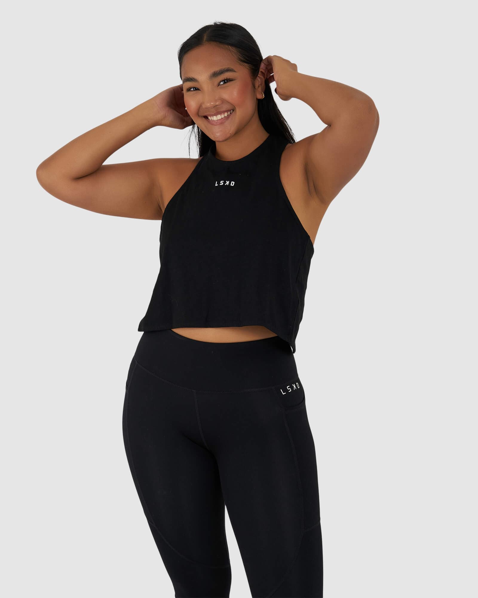 Model wearing Icon Crossover Tank - Black