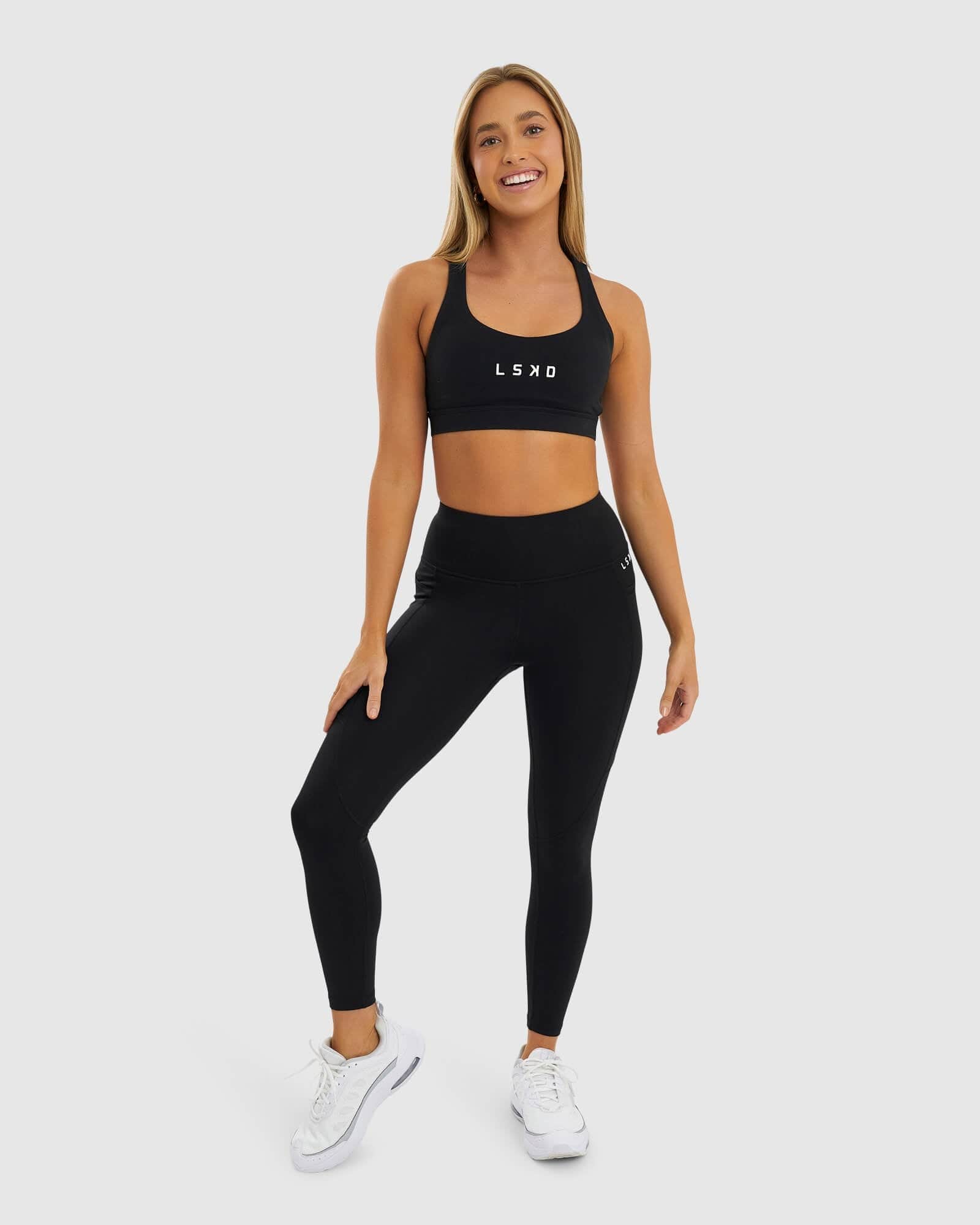 Model wearing Glide 7/8 Length Tight - Black-White