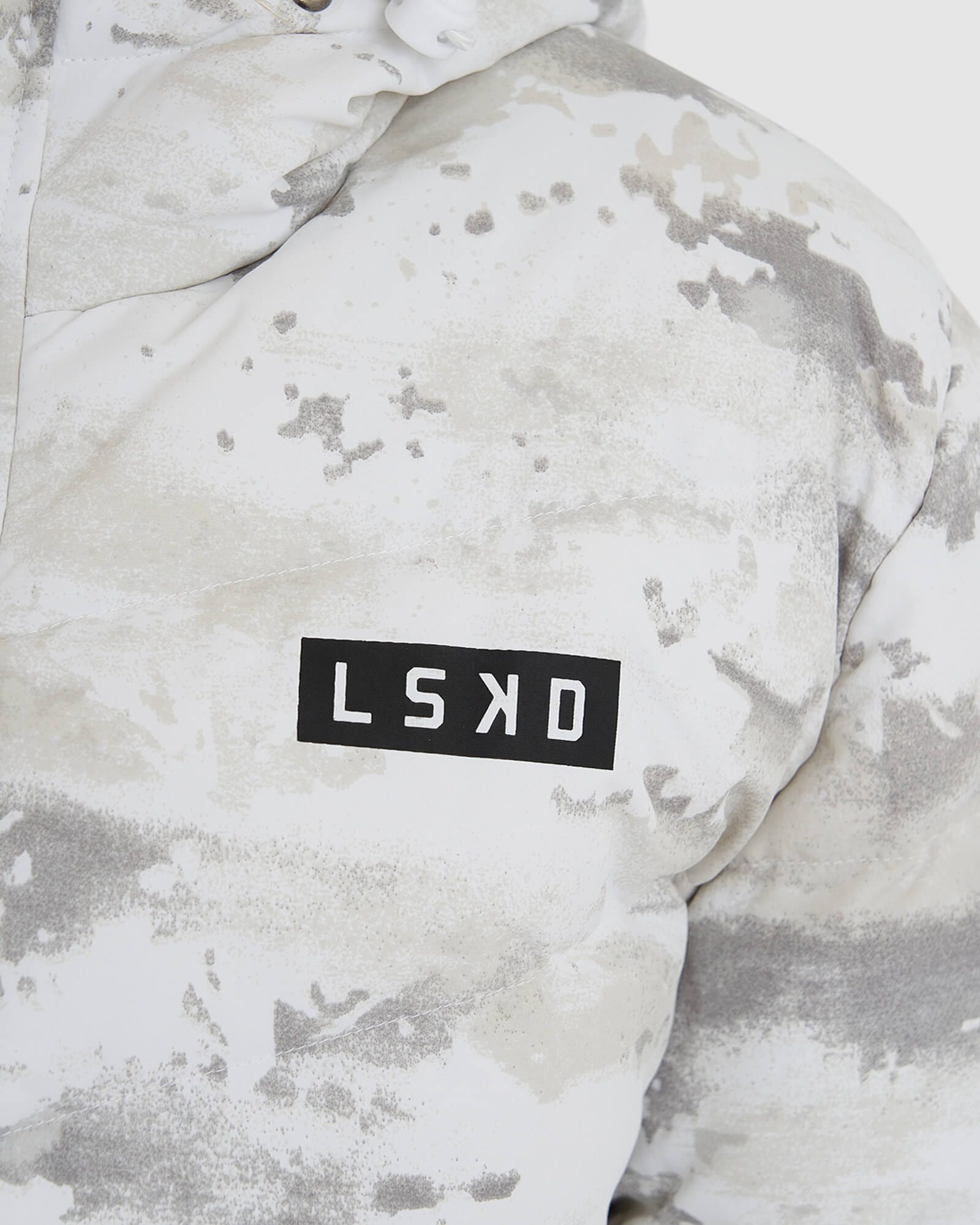 Model wearing Roasted Puffer Jacket 21 - Snow Camo