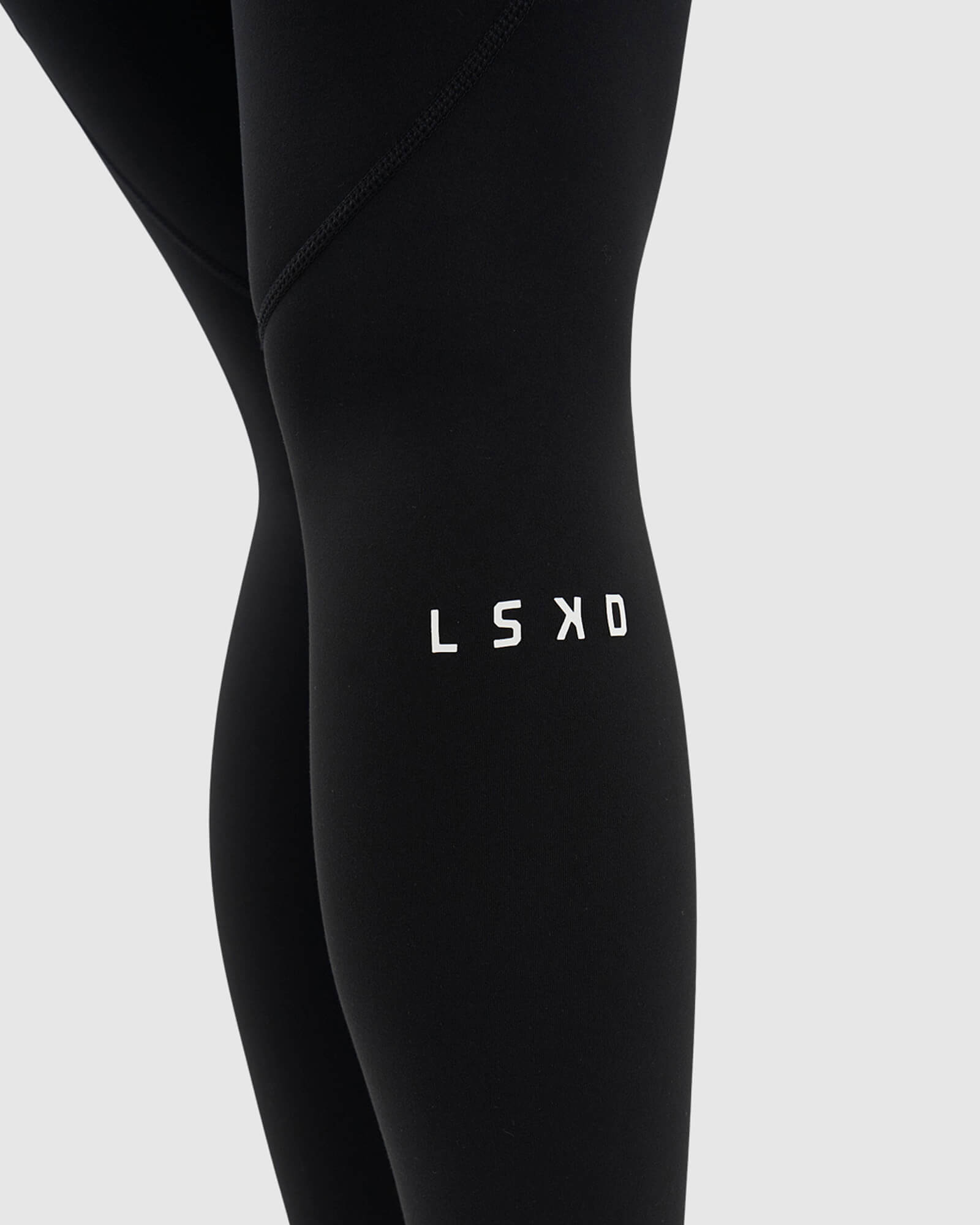 Model wearing Dash 7/8 Length Tight - Black-White