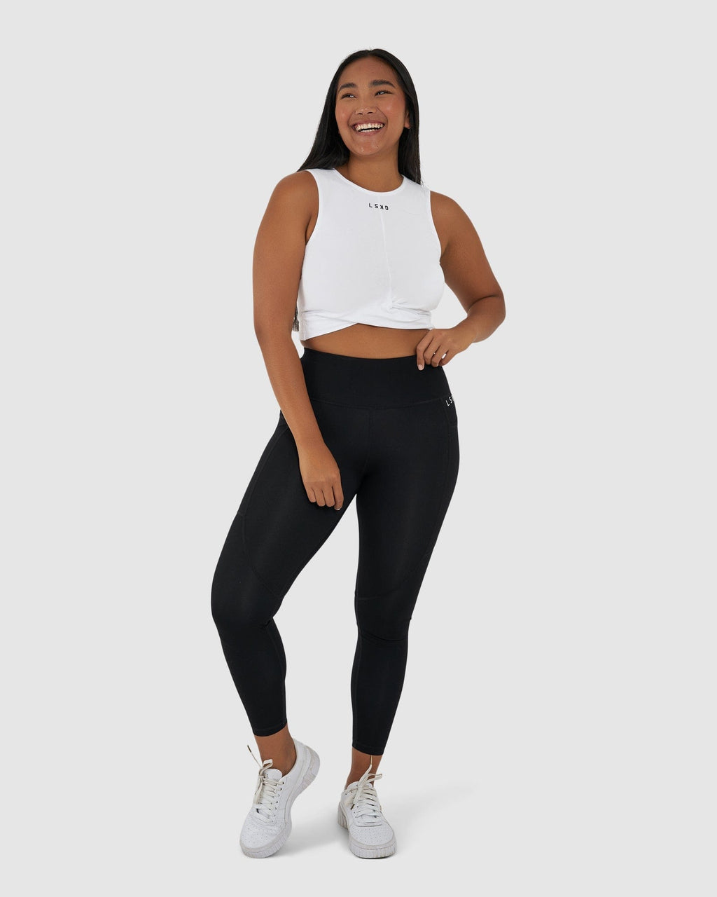 Model wearing Twist Tank - White