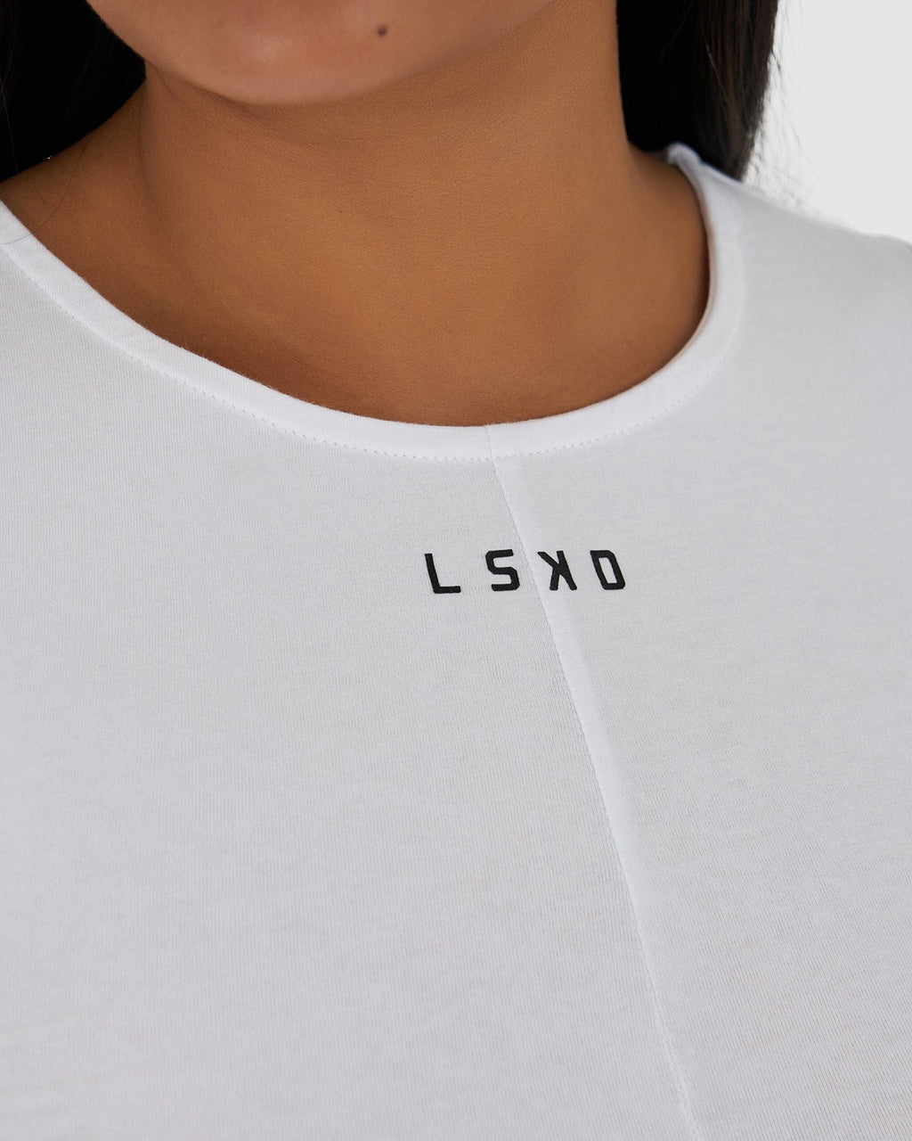 Model wearing Twist Tank - White