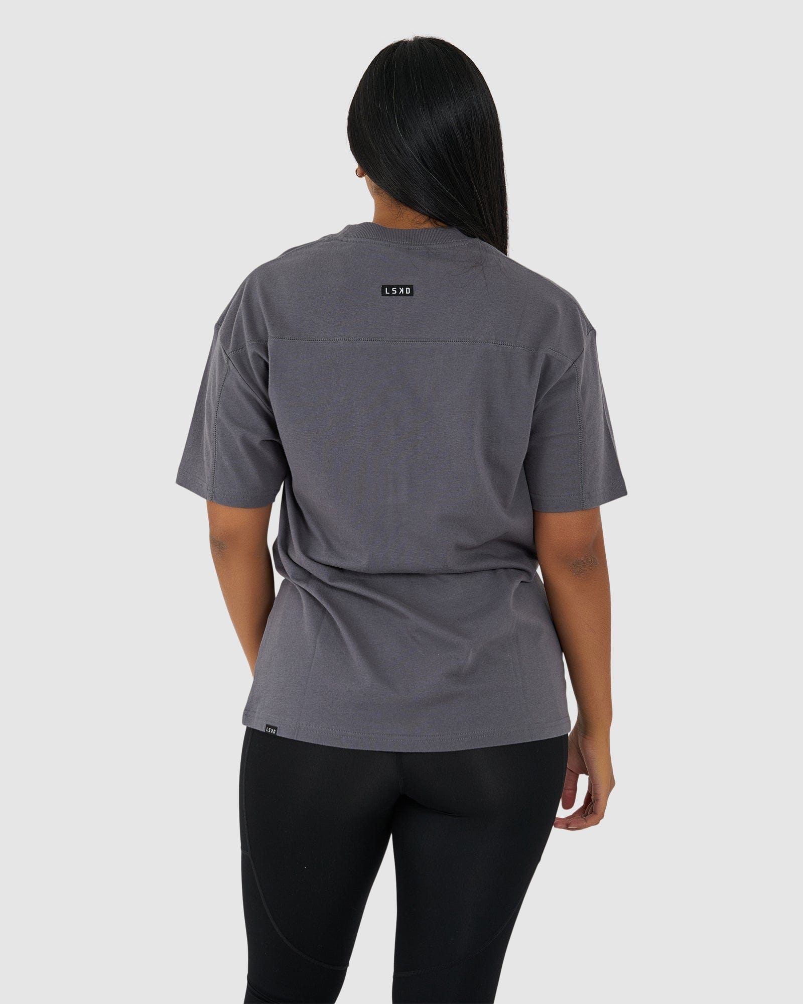 Model wearing Unisex Heavy Hitter Heavyweight Tee Oversize - Iron