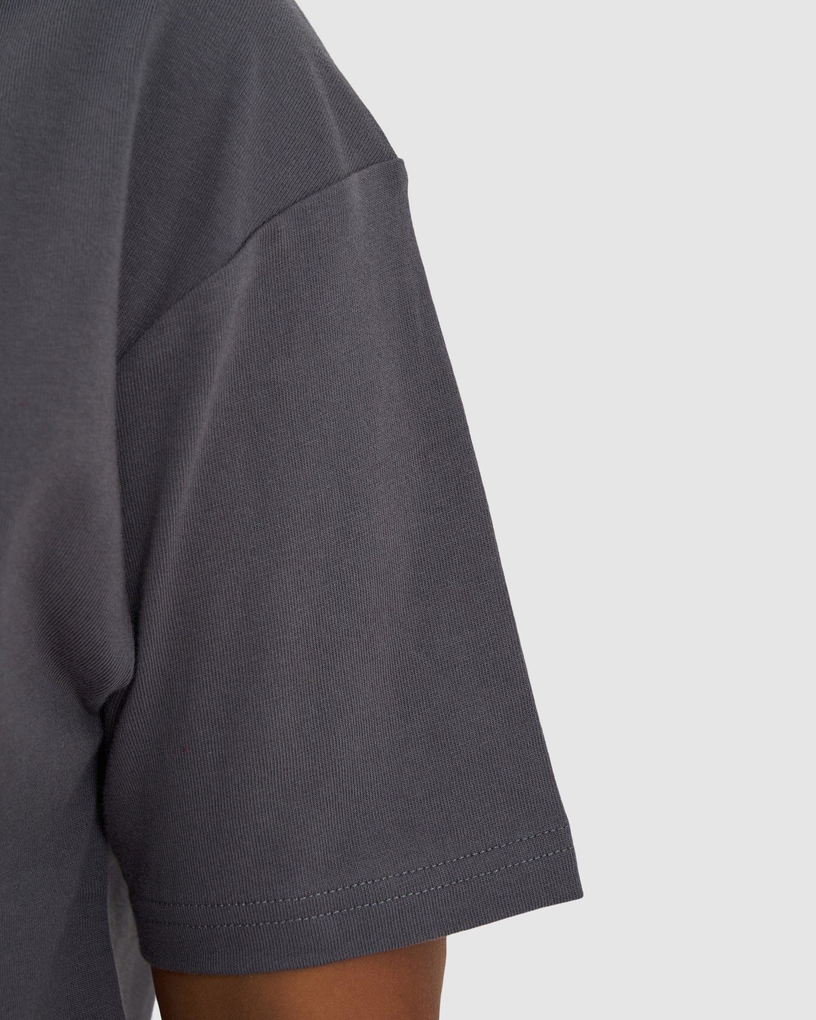 Model wearing Unisex Heavy Hitter Heavyweight Tee Oversize - Iron