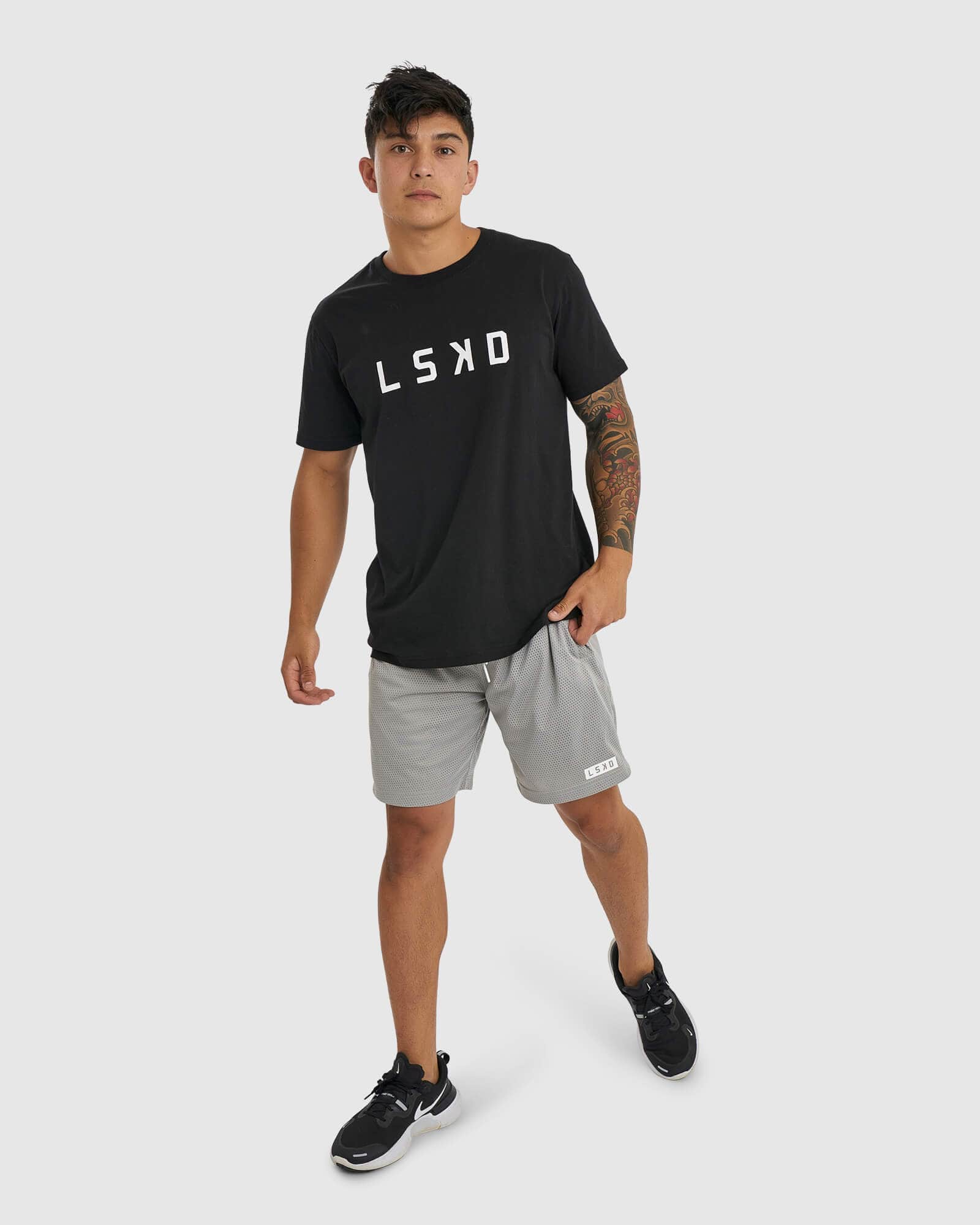 Model wearing Backboard 8" Performance Short - Alloy