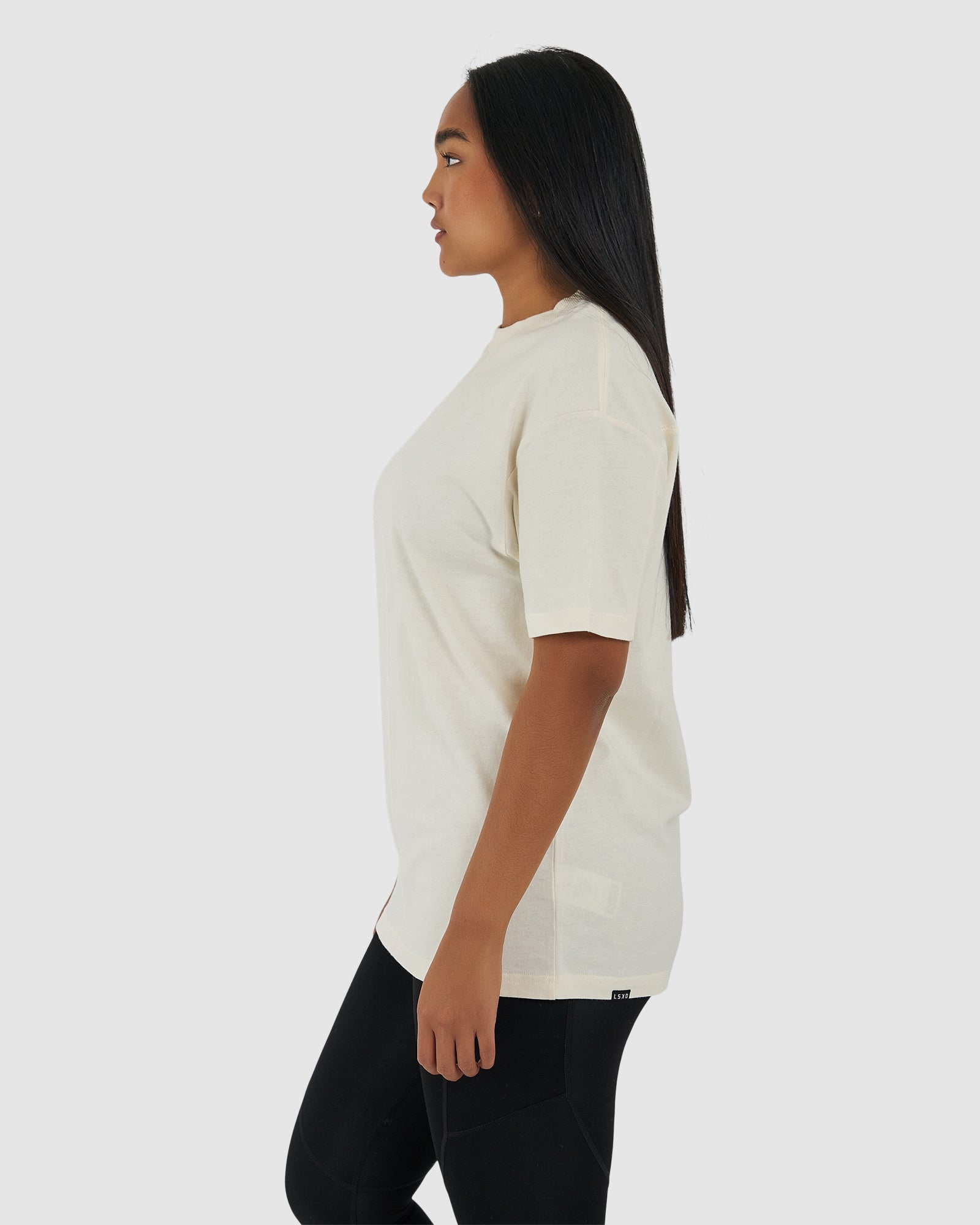 Model wearing Unisex Heavy Hitter Heavyweight Tee Oversize - Creme