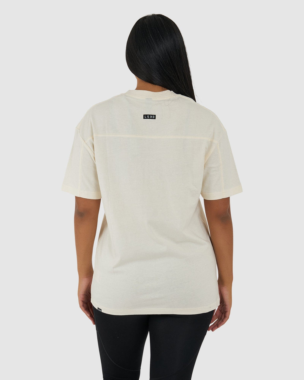 Model wearing Unisex Heavy Hitter Heavyweight Tee Oversize - Creme