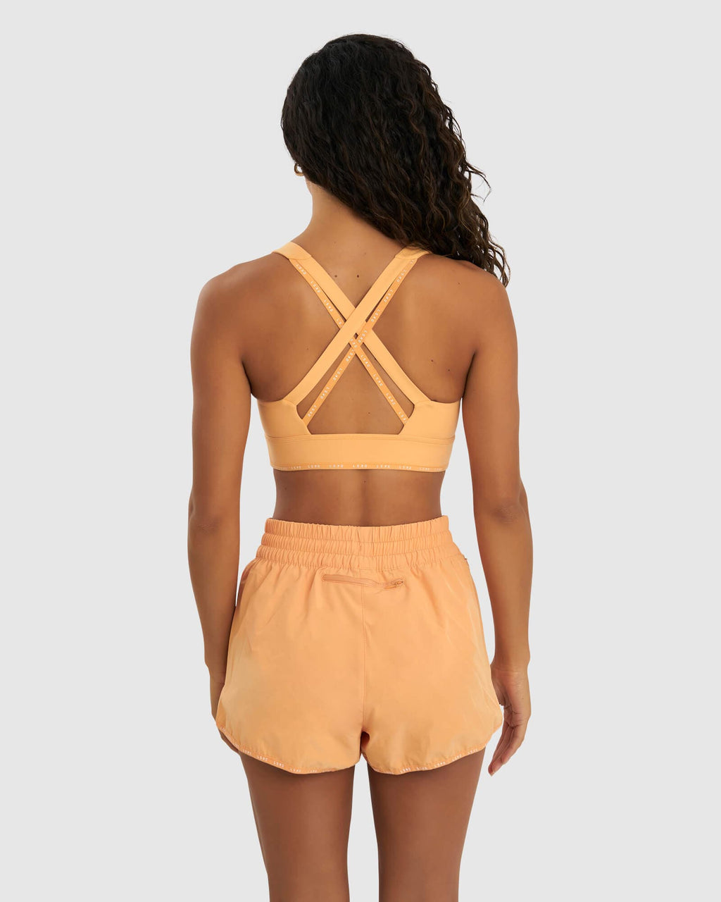 Model wearing MVP Sports Bra - Sherbet