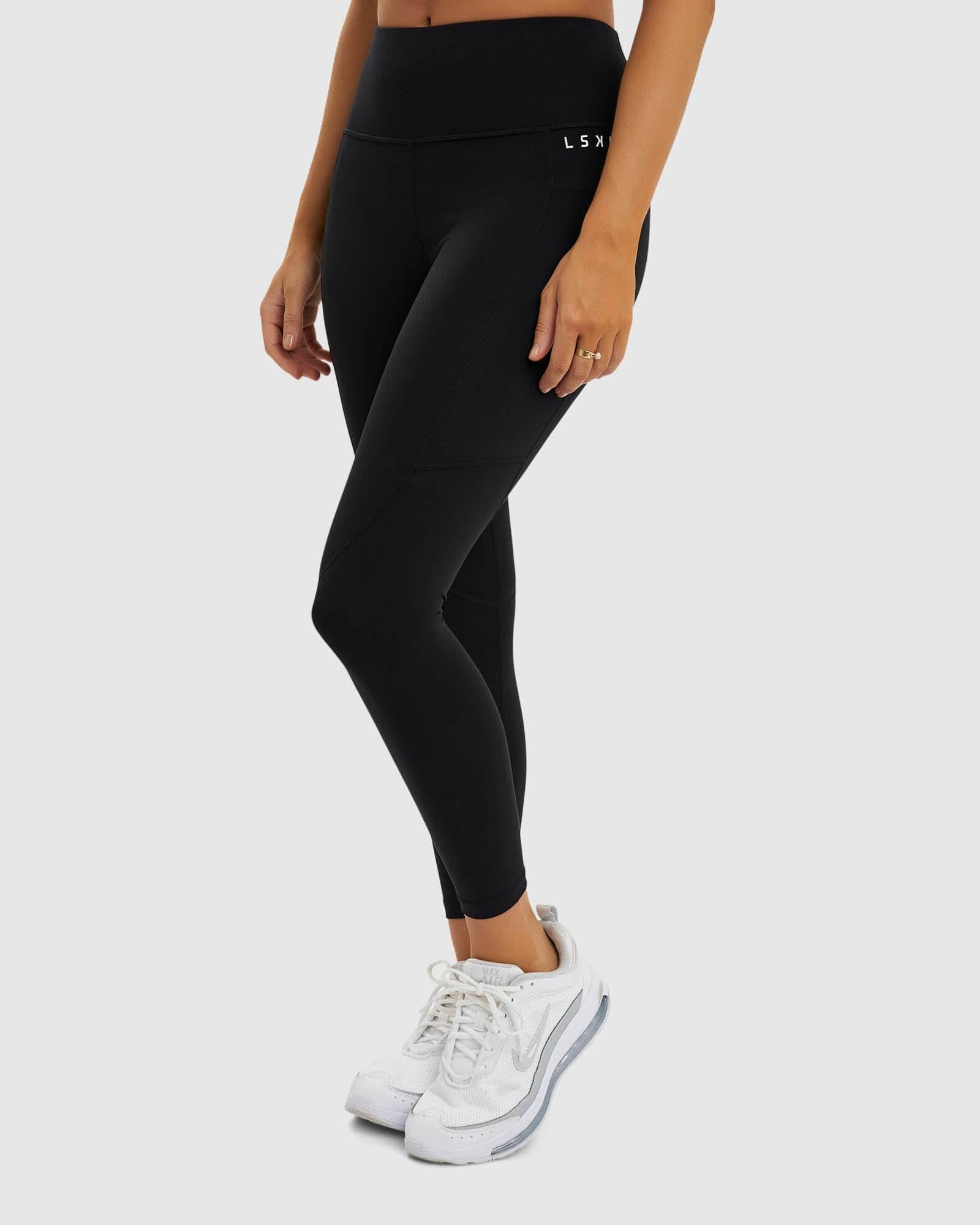 Model wearing Glide 7/8 Length Tight - Black-White