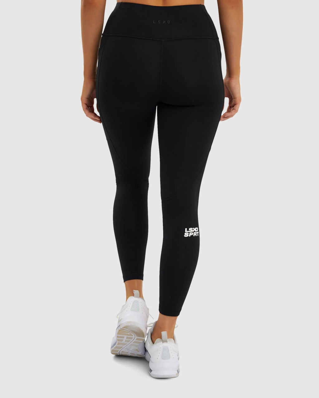 Model wearing Glide 7/8 Length Tight - Black-White