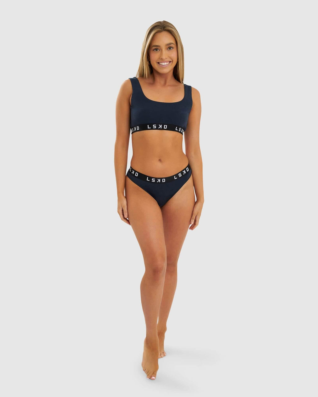 Model wearing Gigi Bikini Brief - Carbon