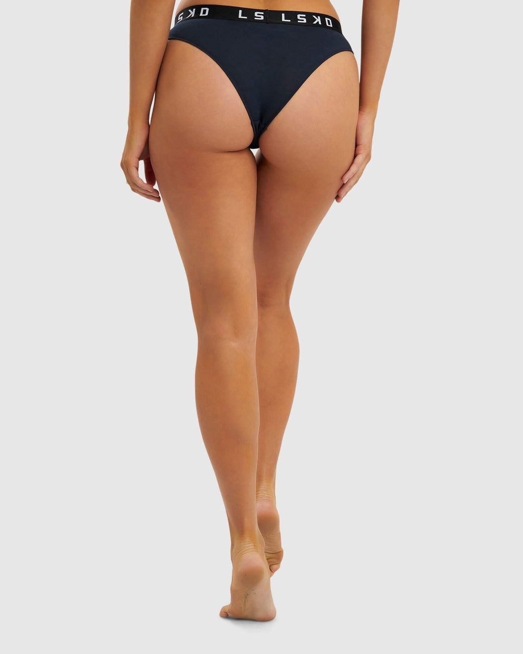 Model wearing Gigi Bikini Brief - Carbon