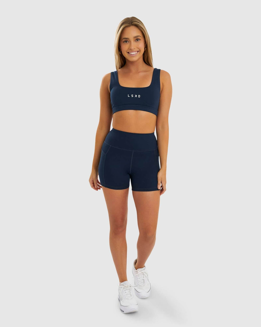 Model wearing Rep X-Short Tight Small Logo - Carbon