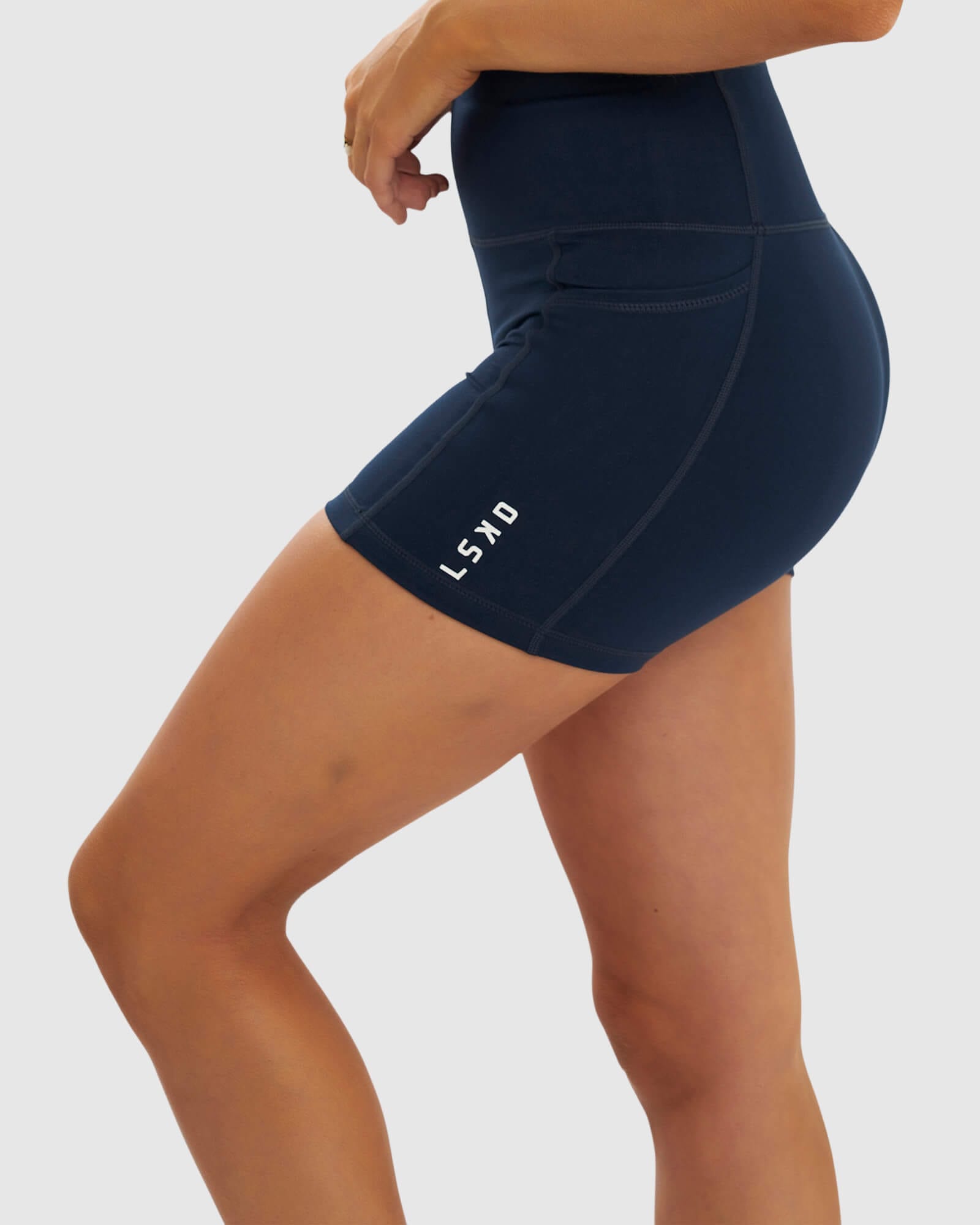Model wearing Rep X-Short Tight Small Logo - Carbon