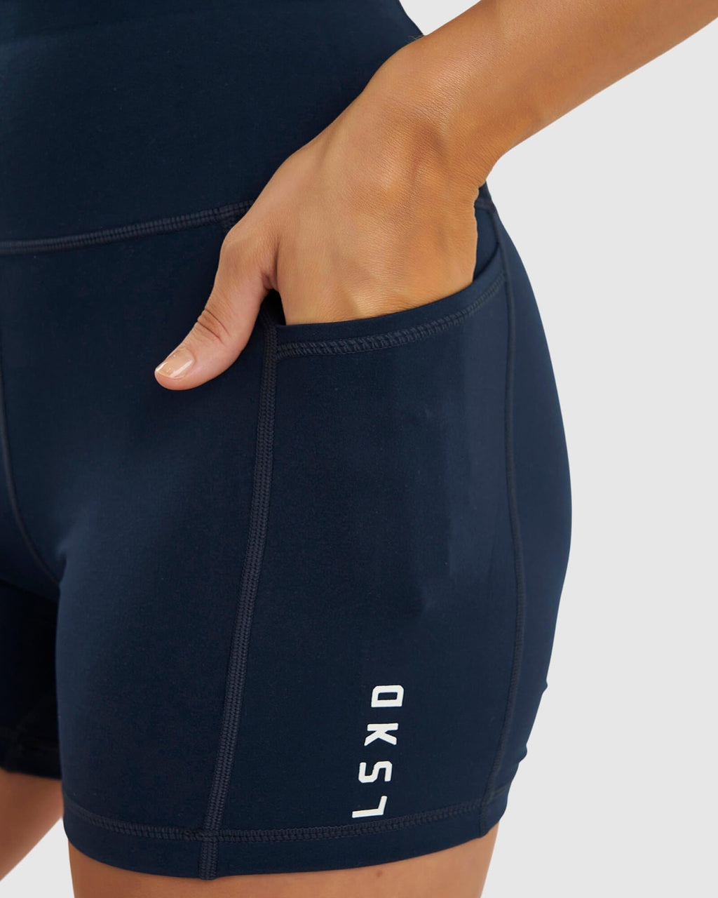 Model wearing Rep X-Short Tight Small Logo - Carbon