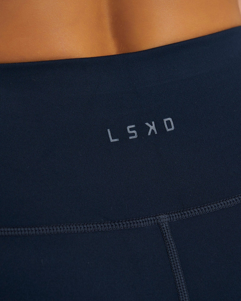 Model wearing Rep X-Short Tight Small Logo - Carbon