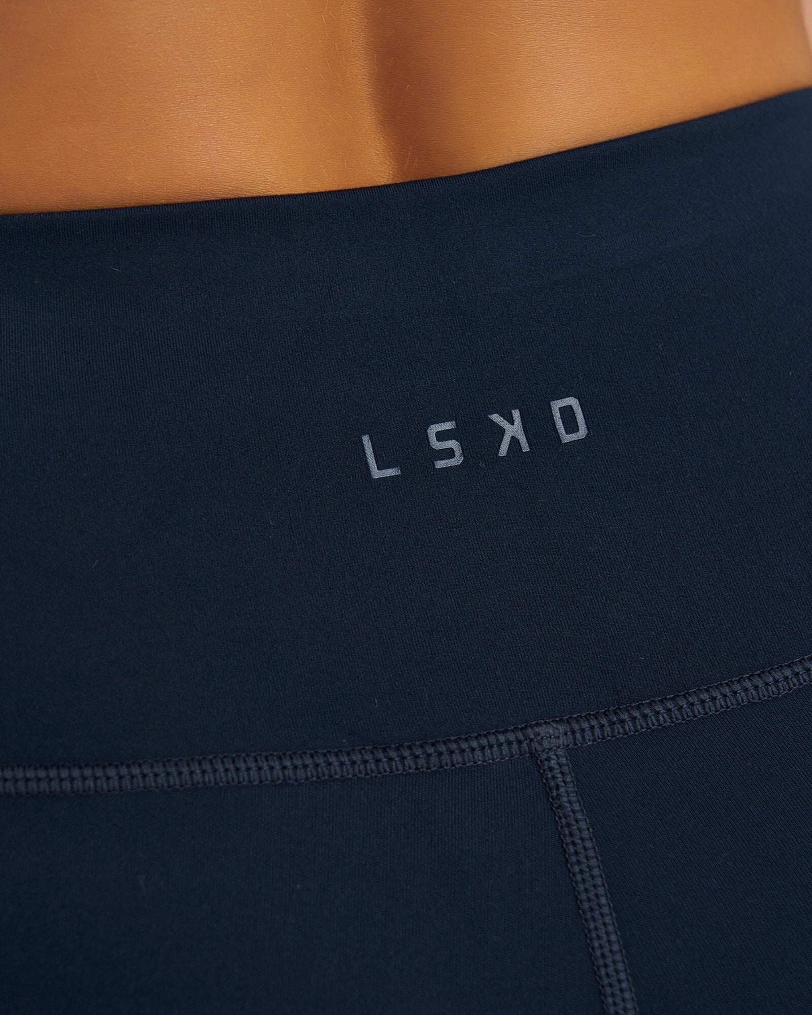 Model wearing Rep X-Short Tight Small Logo - Carbon