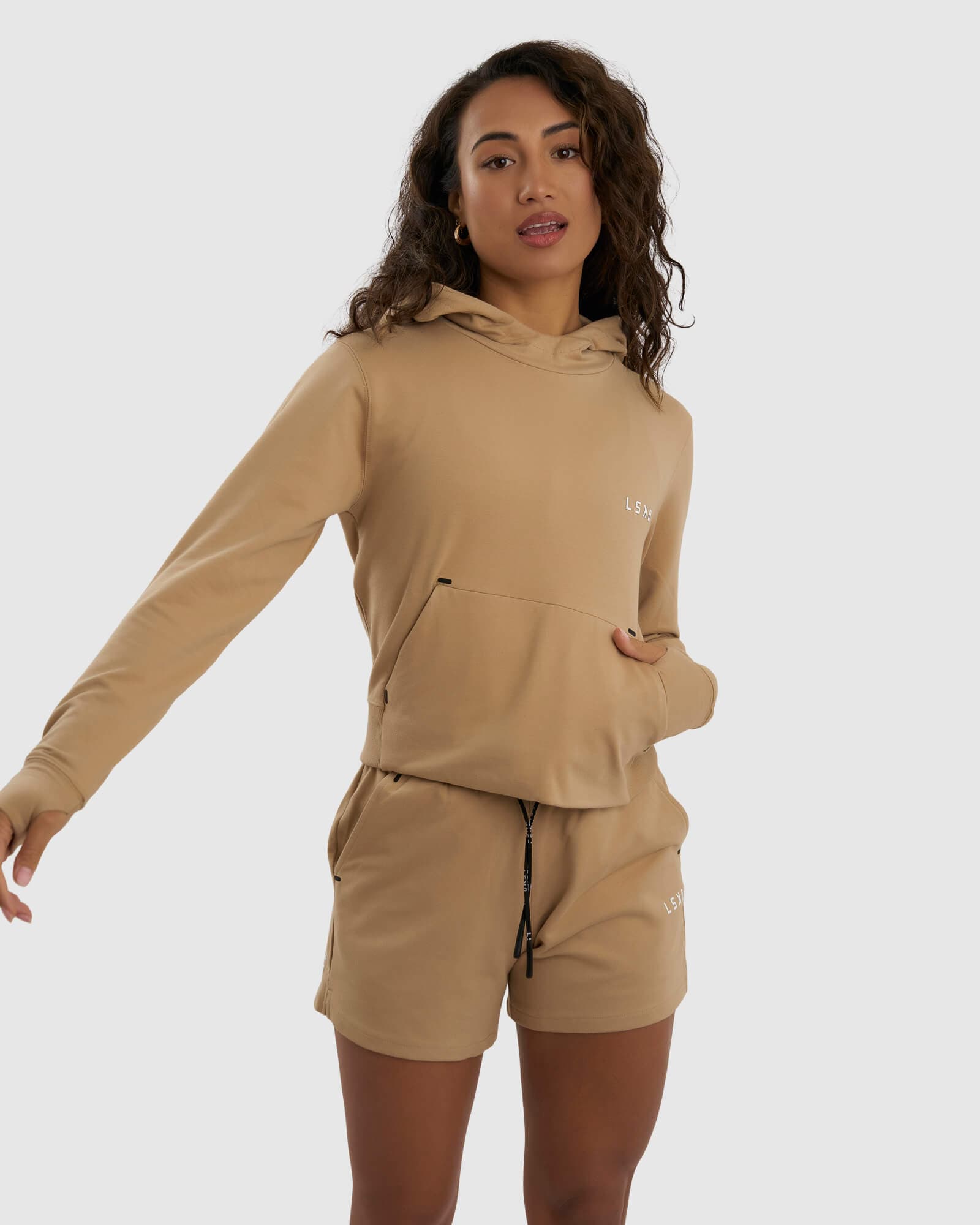 Model wearing Grind Hoodie - Almond