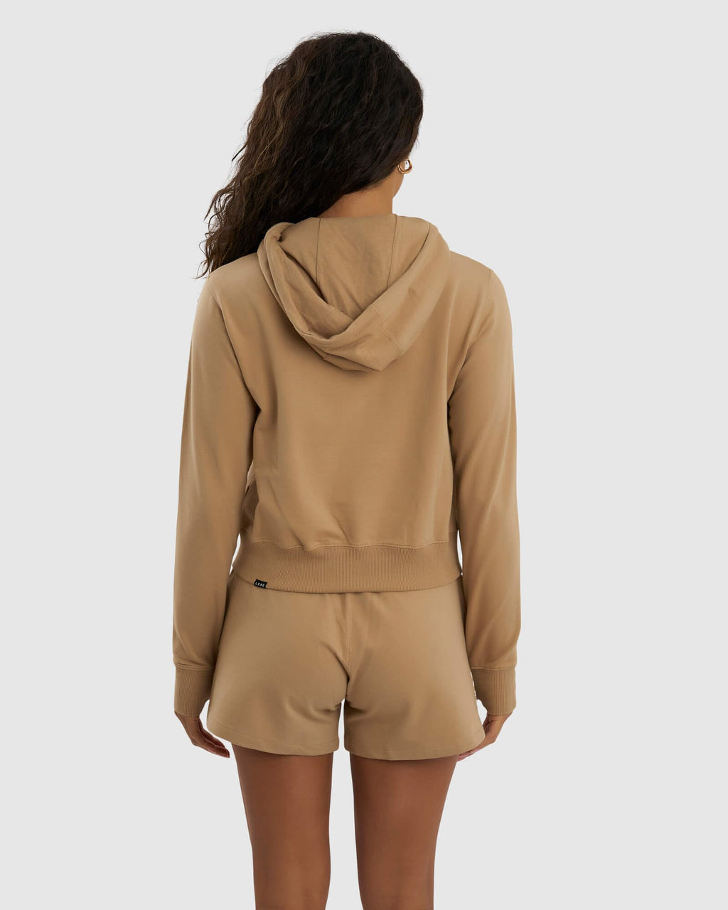 Model wearing Grind Hoodie - Almond