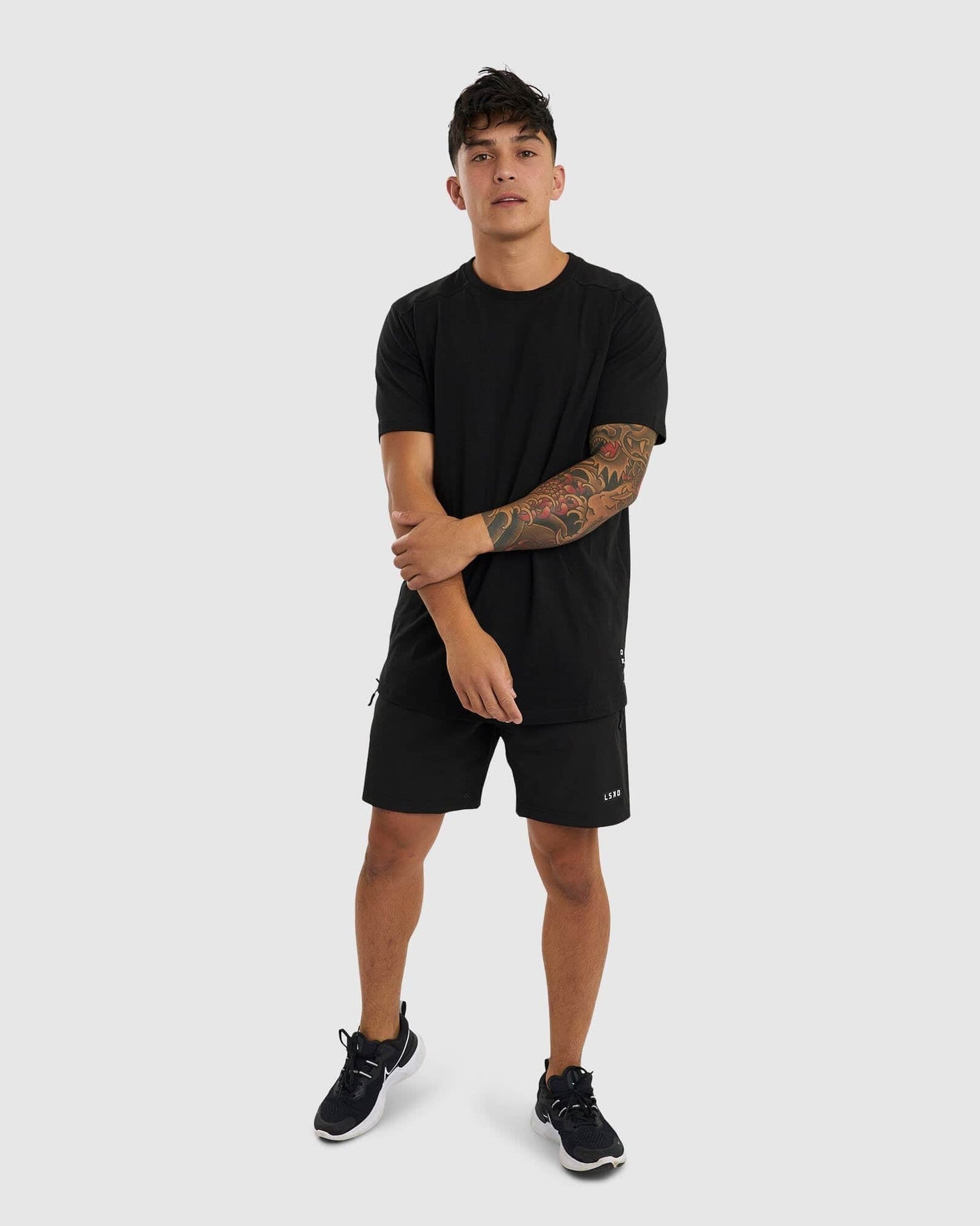 Model wearing Tab Tee - Black