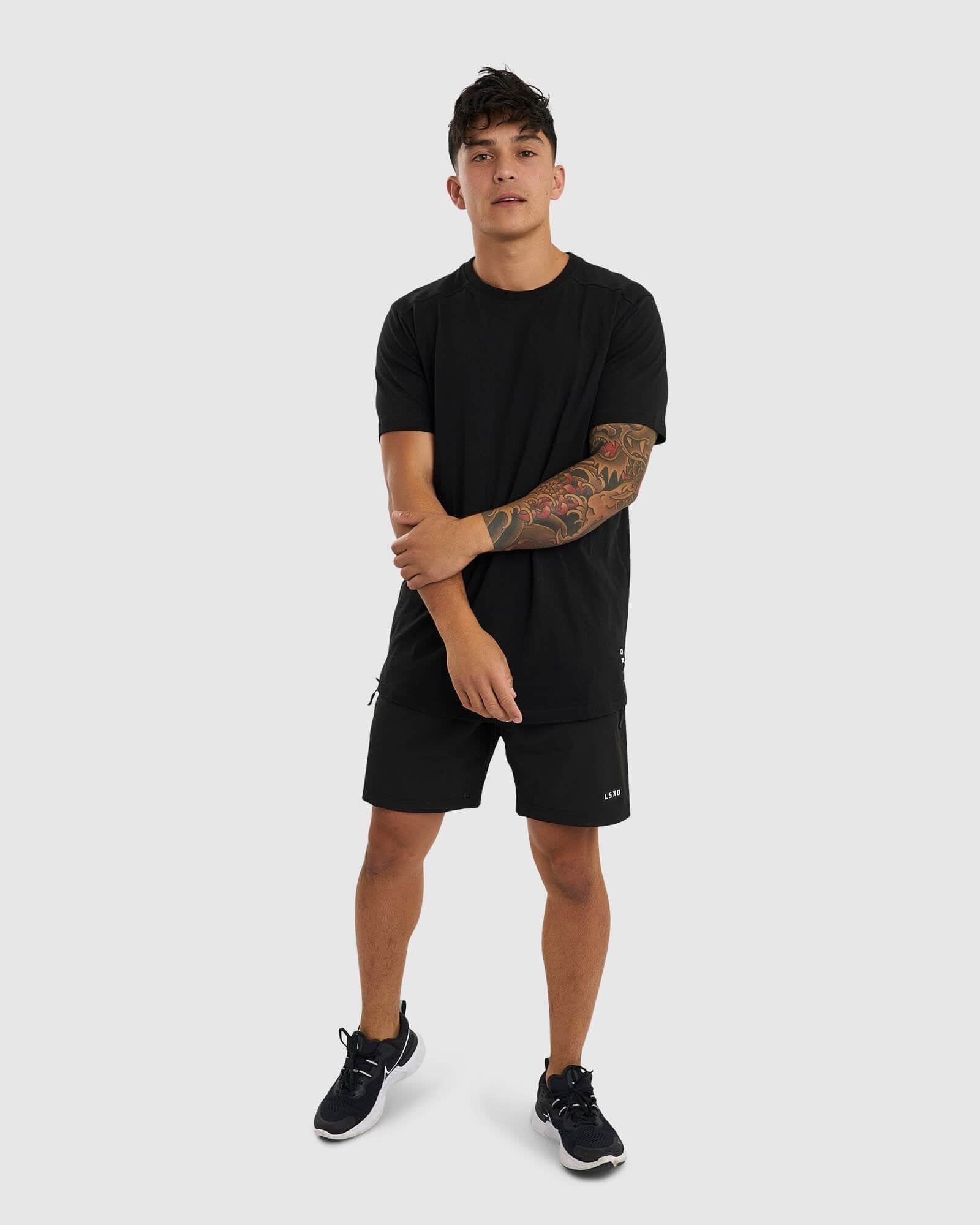 Model wearing Tab Tee - Black
