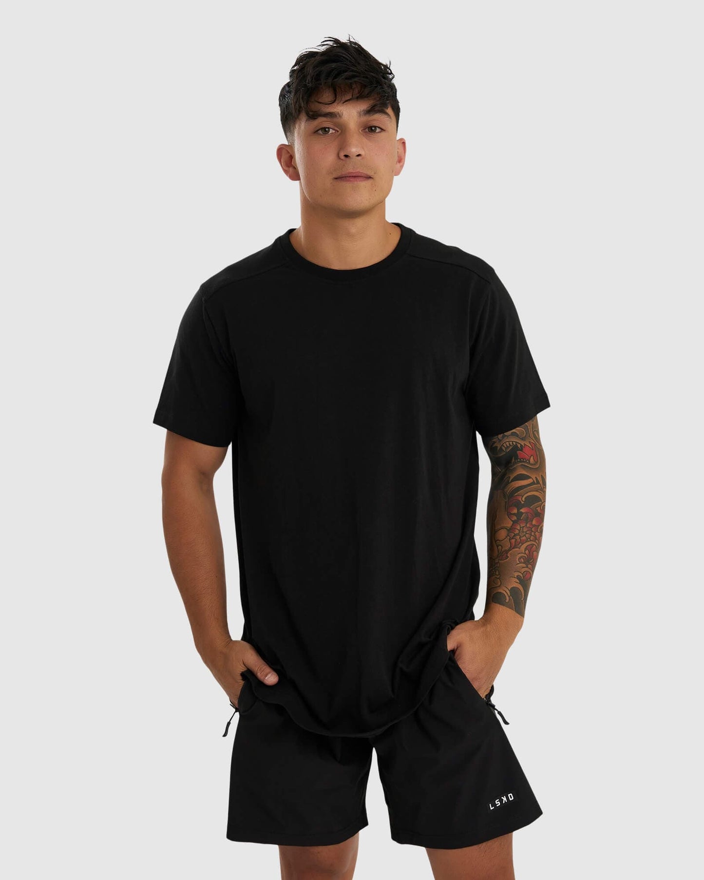 Model wearing Tab Tee - Black