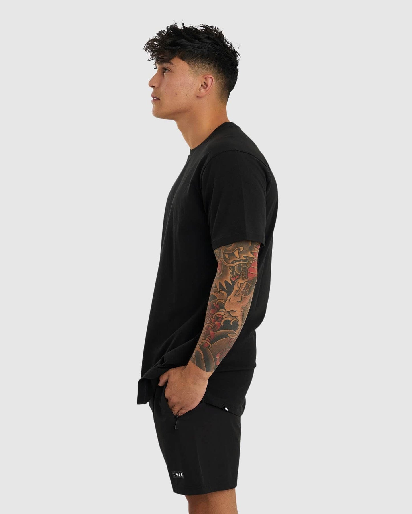 Model wearing Tab Tee - Black