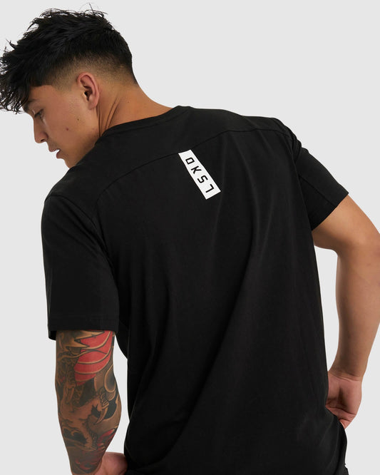 Model wearing Tab Tee - Black