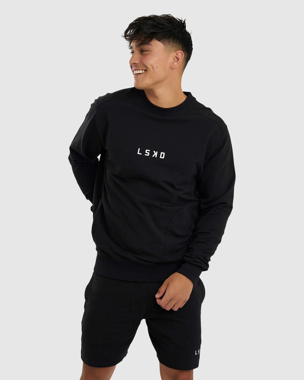 Model wearing Unisex Routine Sweater - Black