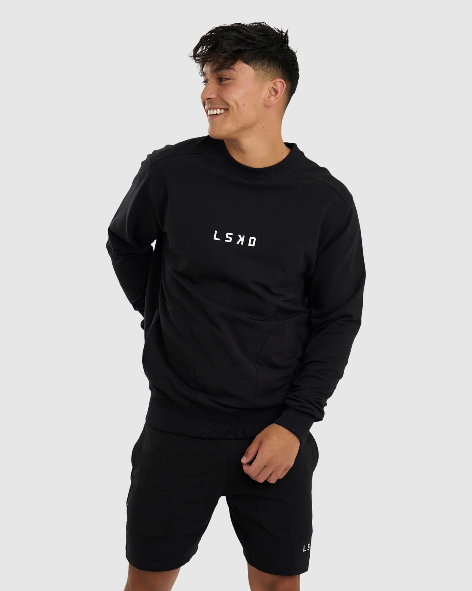Model wearing Unisex Routine Sweater - Black