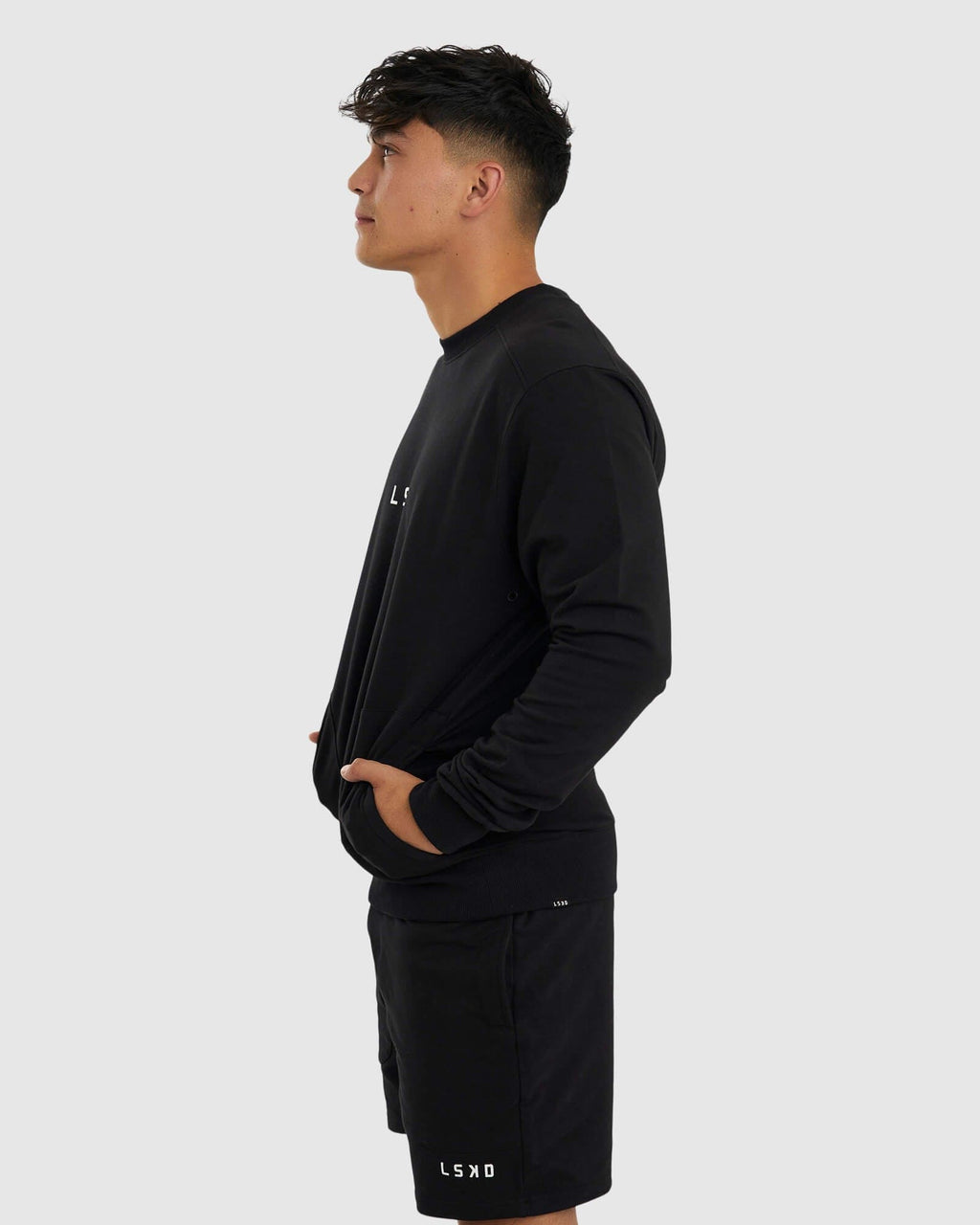 Model wearing Unisex Routine Sweater - Black