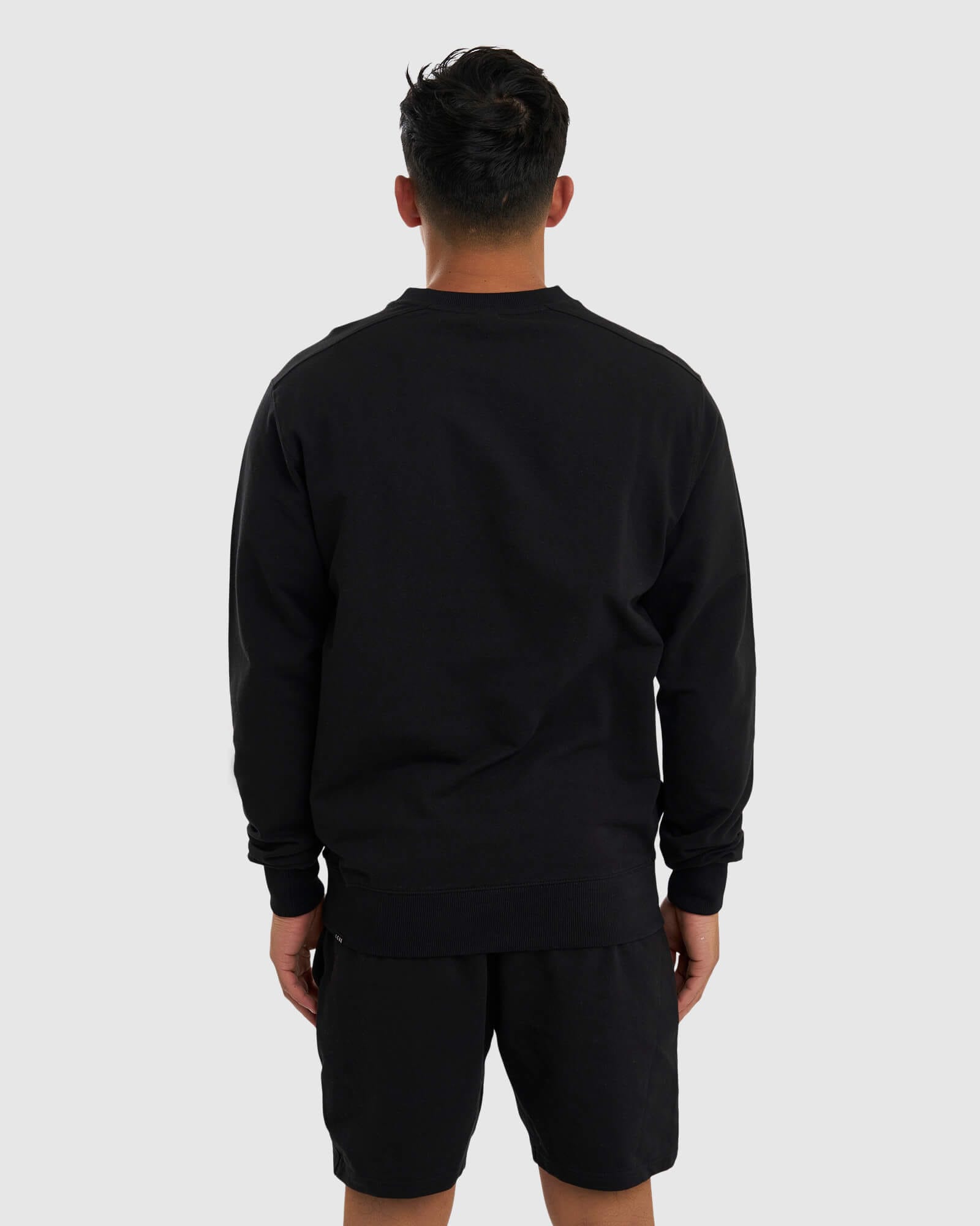 Model wearing Unisex Routine Sweater - Black