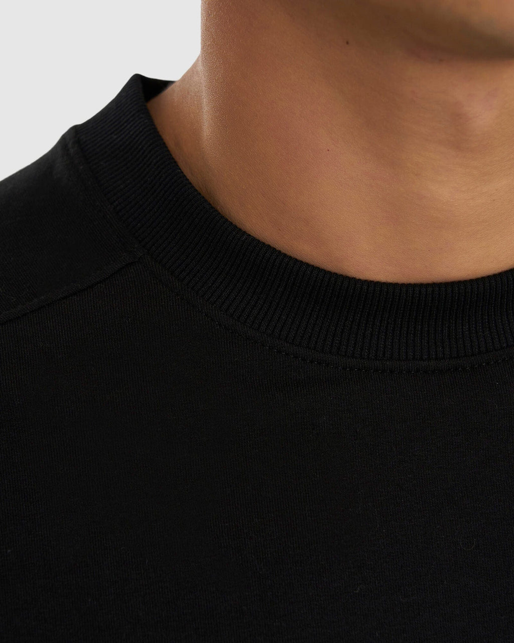 Model wearing Unisex Routine Sweater - Black