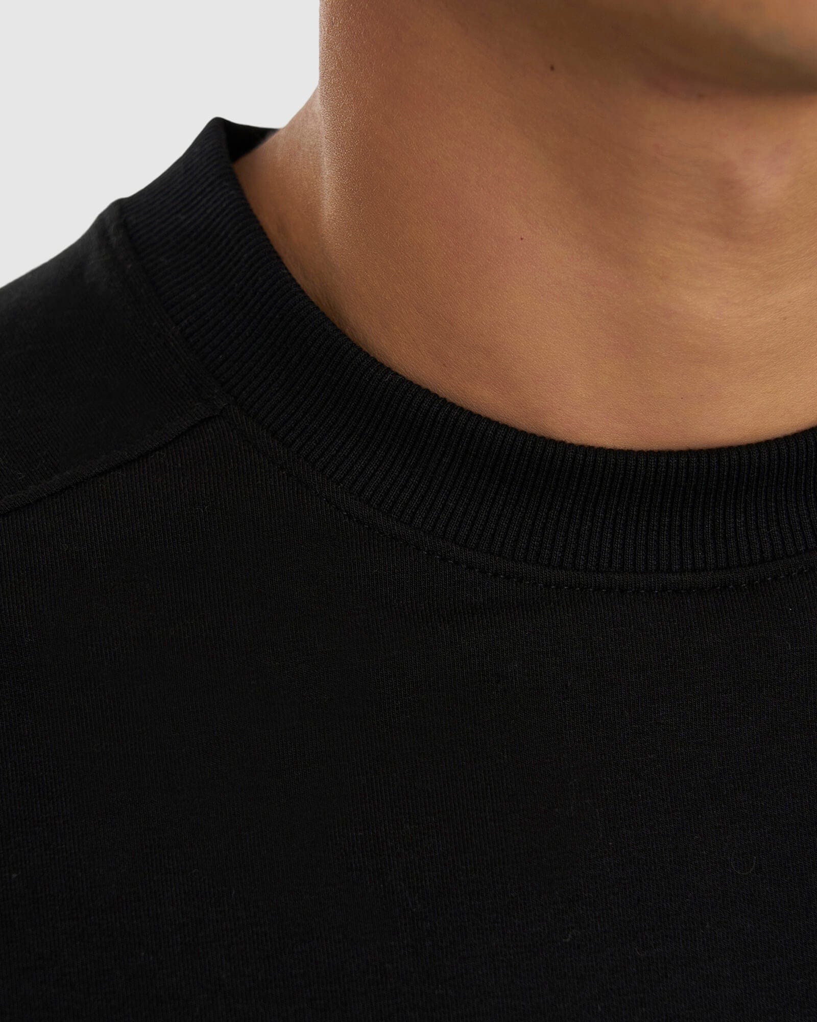 Model wearing Unisex Routine Sweater - Black