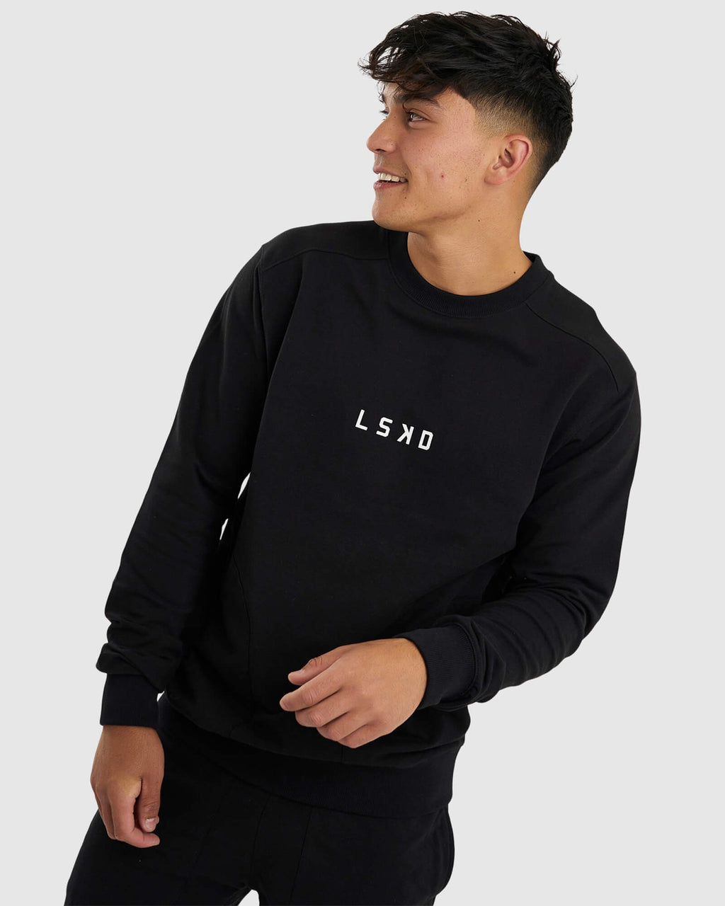 Model wearing Unisex Routine Sweater - Black
