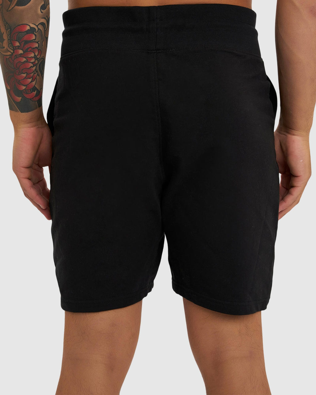 Model wearing Routine Track Short - Black