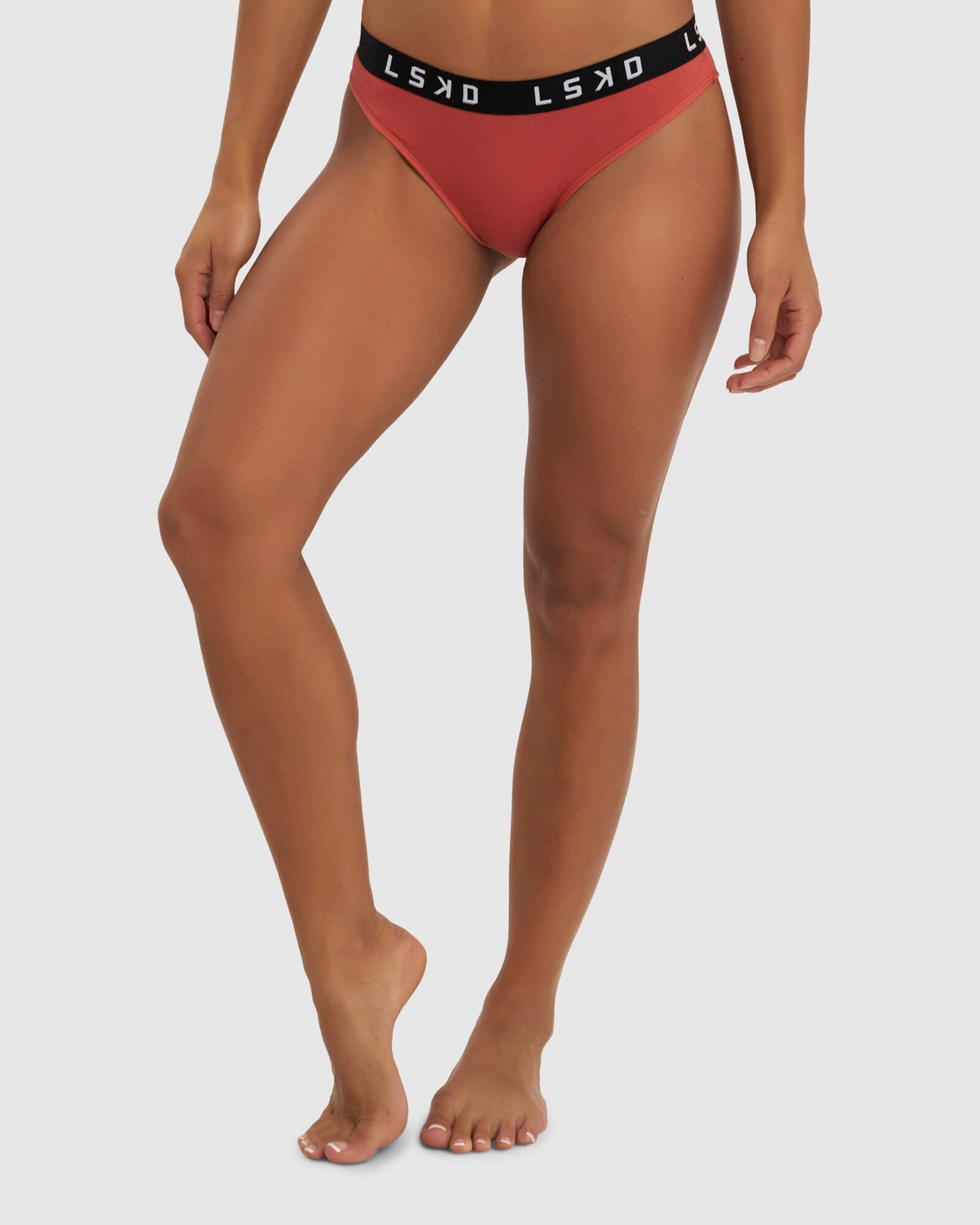 Model wearing Gigi Bikini Brief - Hot Tamale