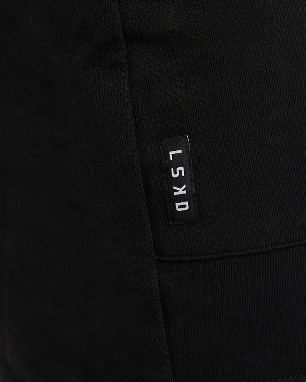 Model wearing Routine Track Short - Black