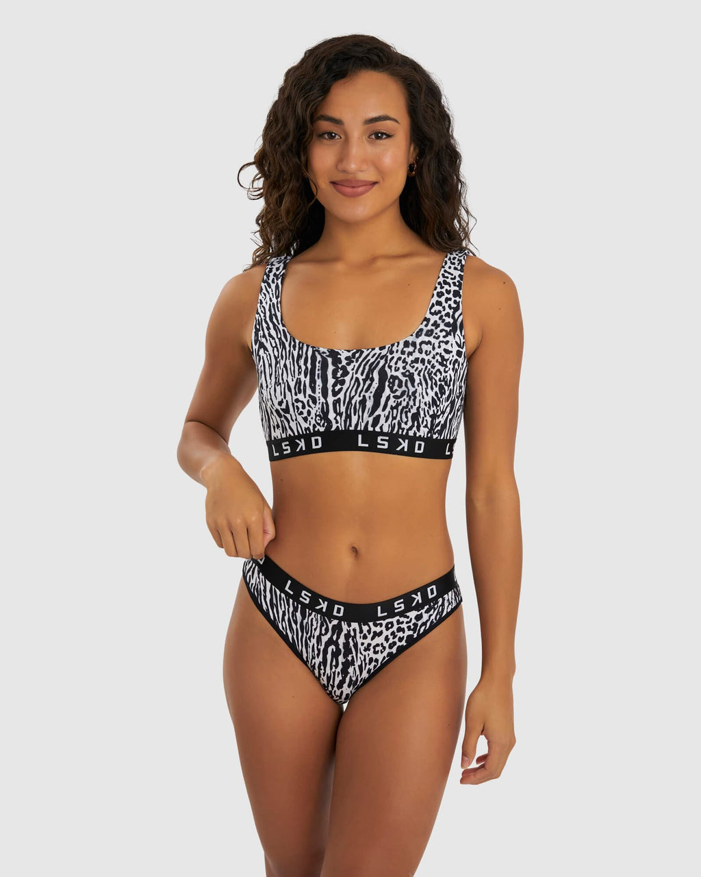 Model wearing Gigi Lounge Bra - Snow Leopard