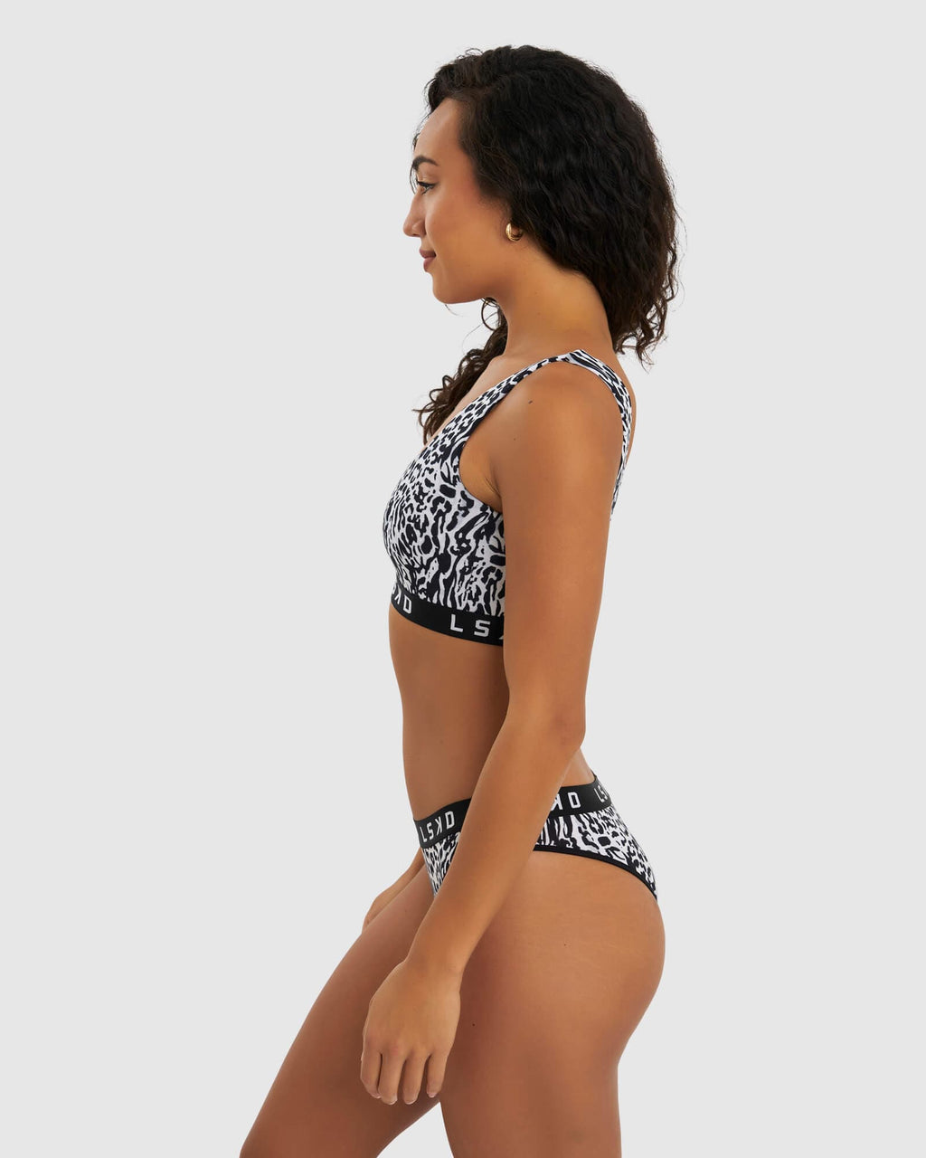 Model wearing Gigi Lounge Bra - Snow Leopard