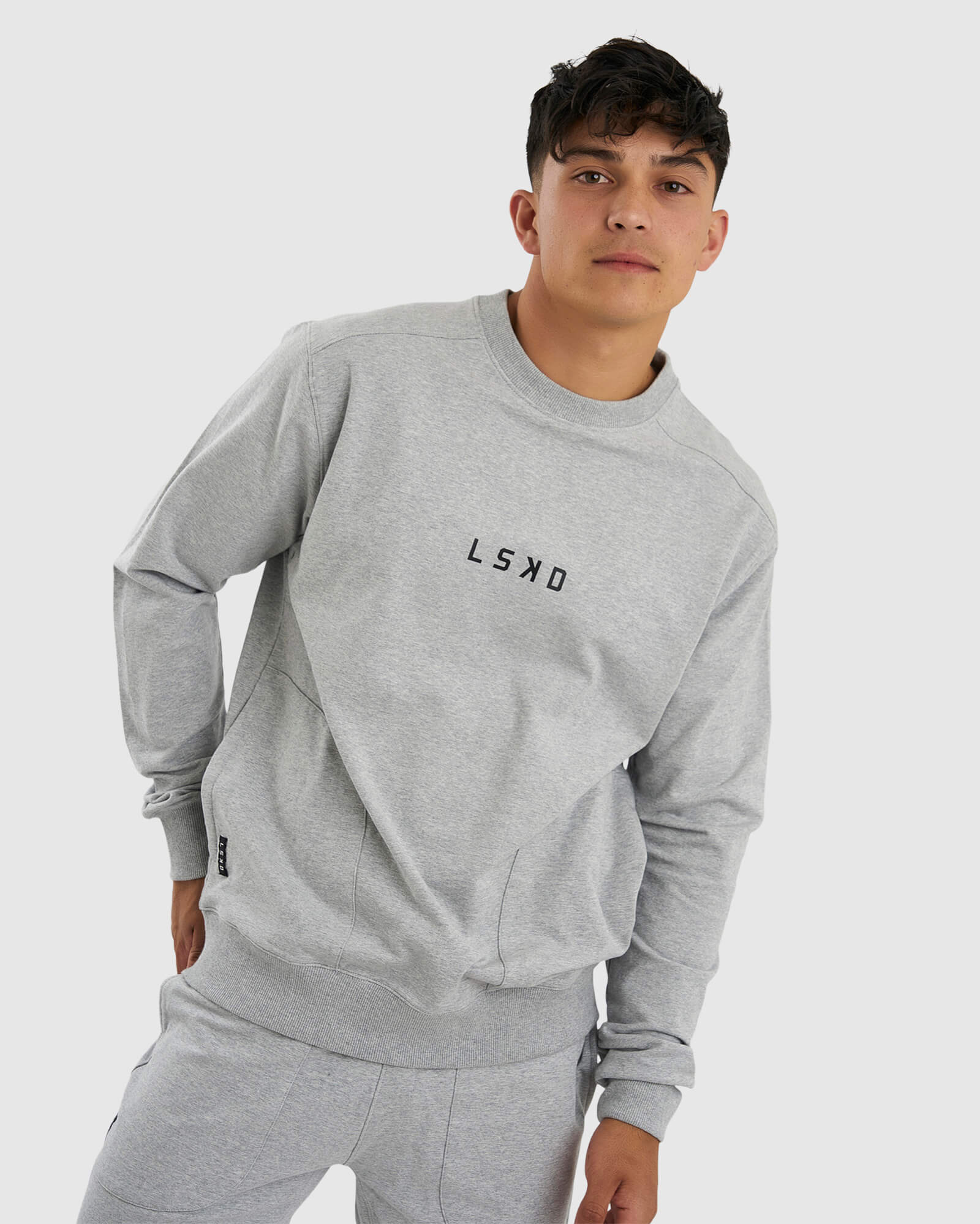 Model wearing Unisex Routine Sweater - Lt Grey Marl