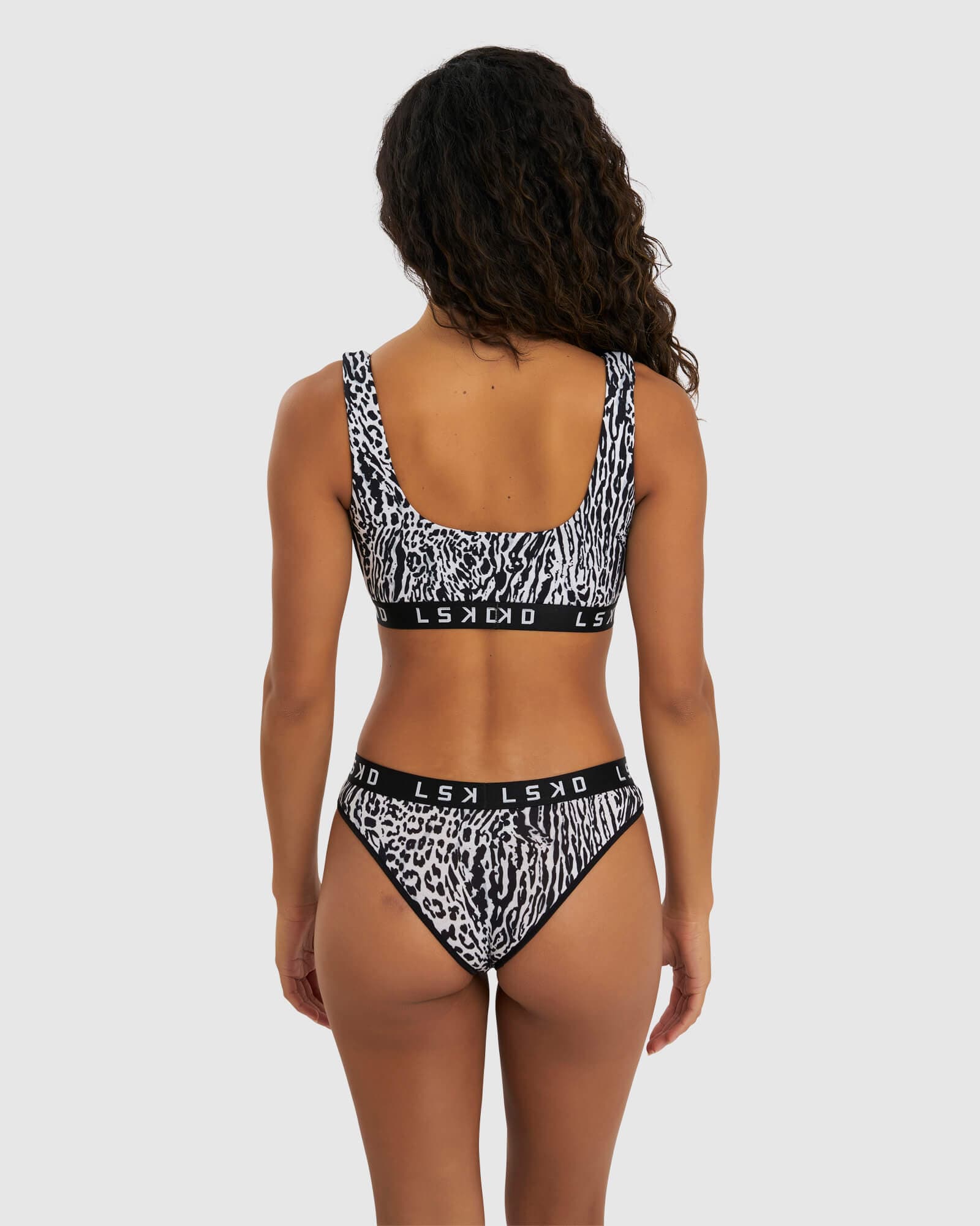 Model wearing Gigi Lounge Bra - Snow Leopard