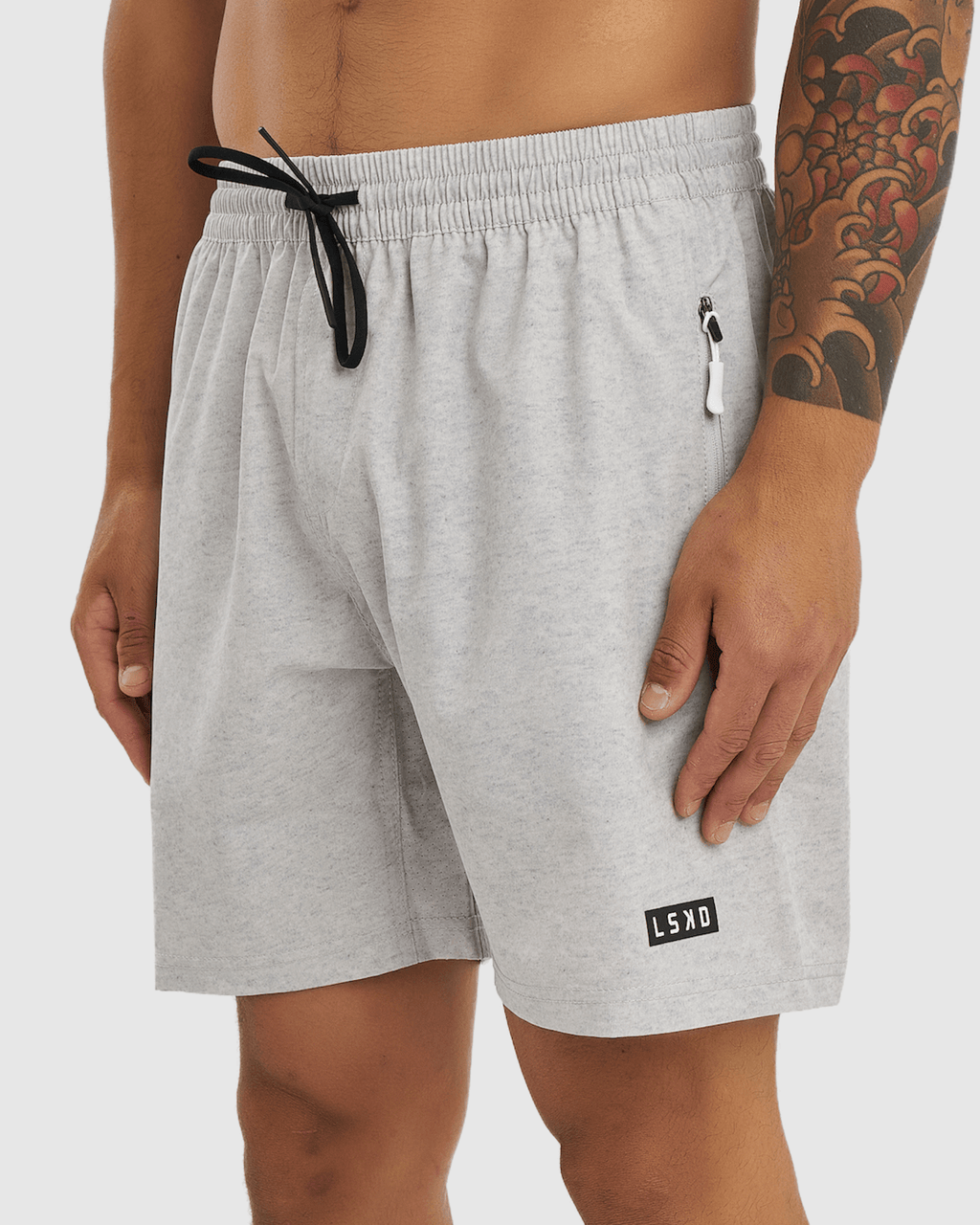 Model wearing Rep 7" Performance Short - Lt Grey Marl