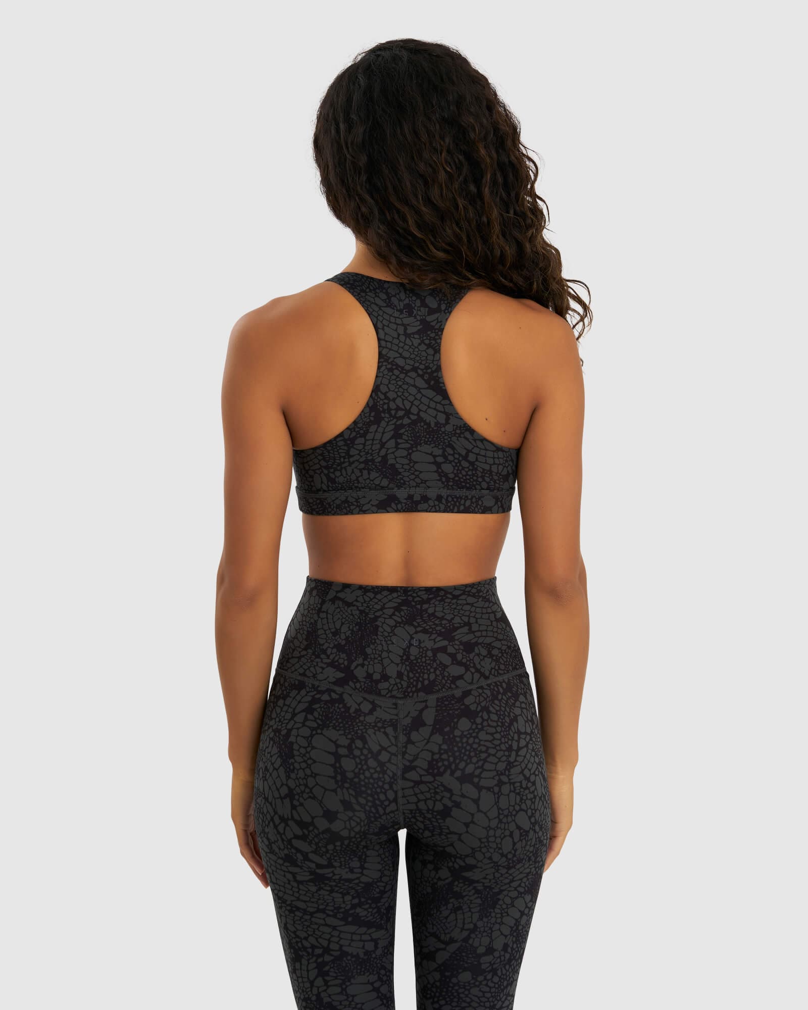 Model wearing Base Sports Bra - Black Mamba