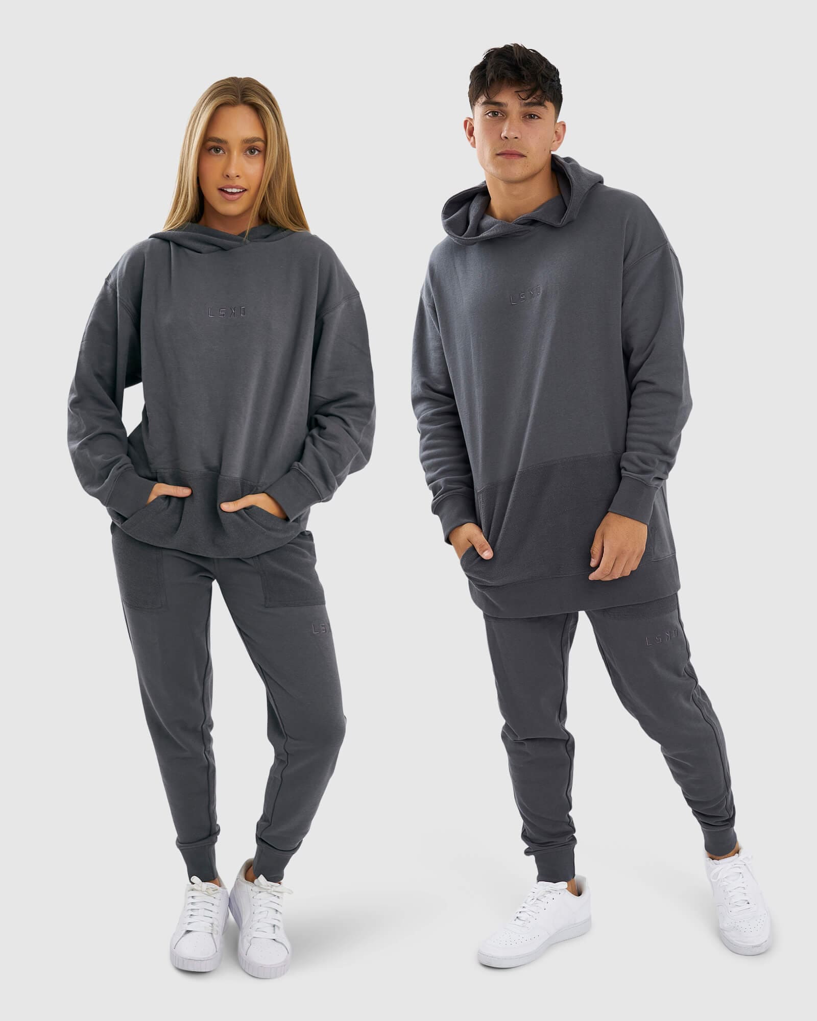 Model wearing Unisex Locker Room Track Pant - Iron