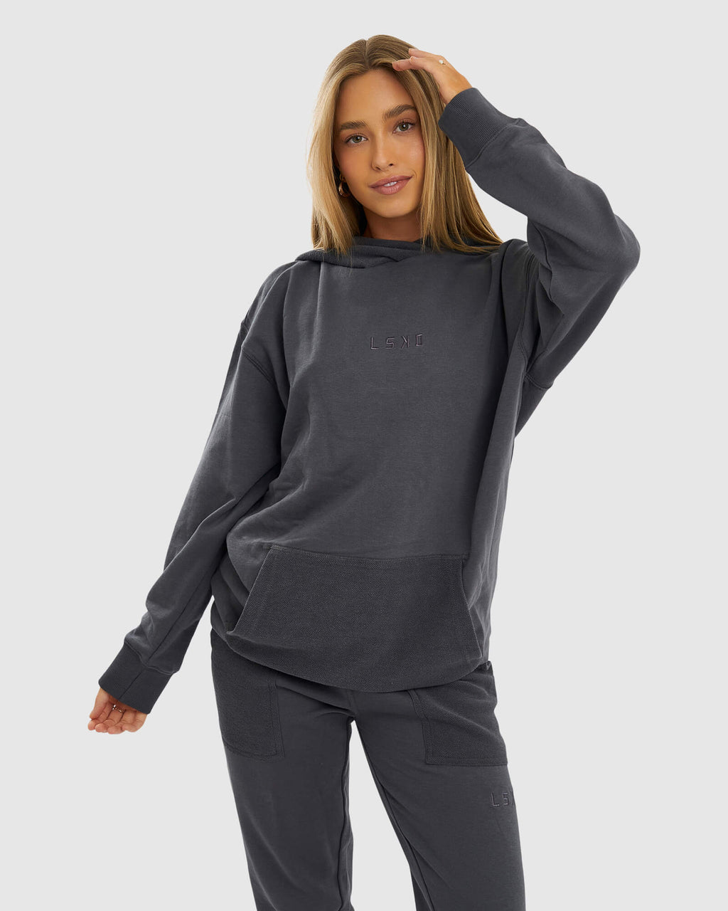Model wearing Unisex Locker Room Hoodie Oversize - Iron