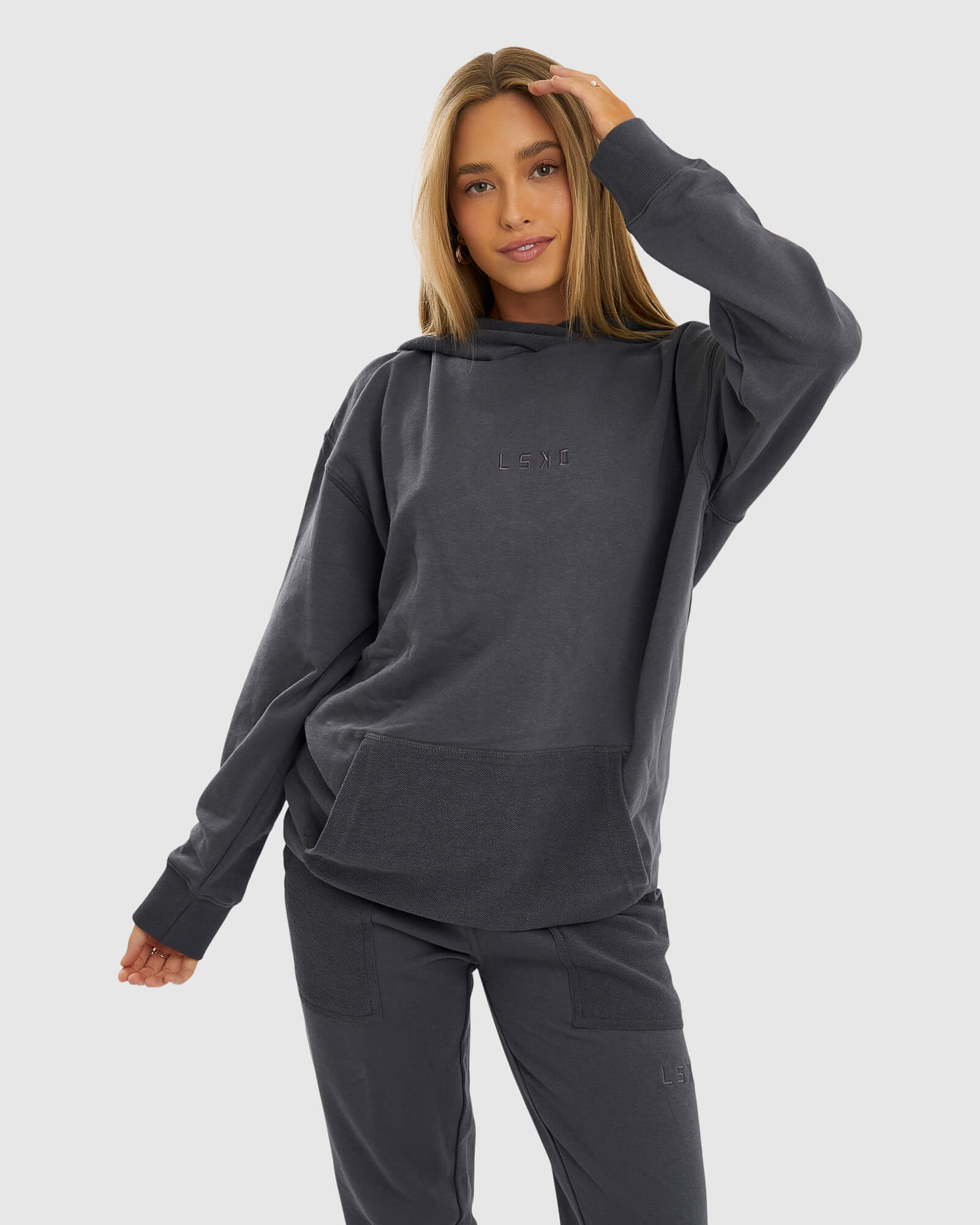 Model wearing Unisex Locker Room Hoodie Oversize - Iron