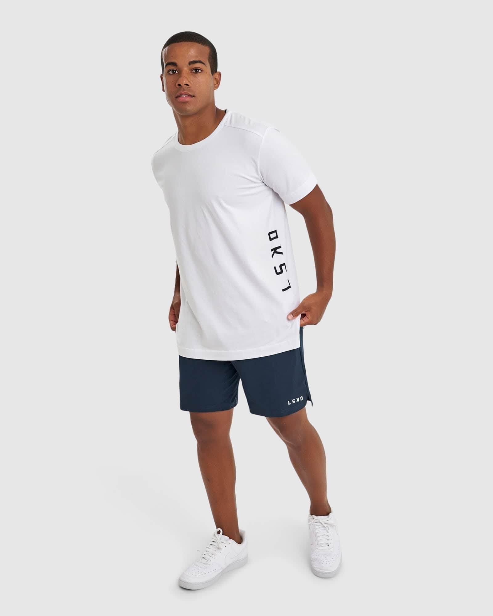 Model wearing Intensity 7" Performance Short - Carbon