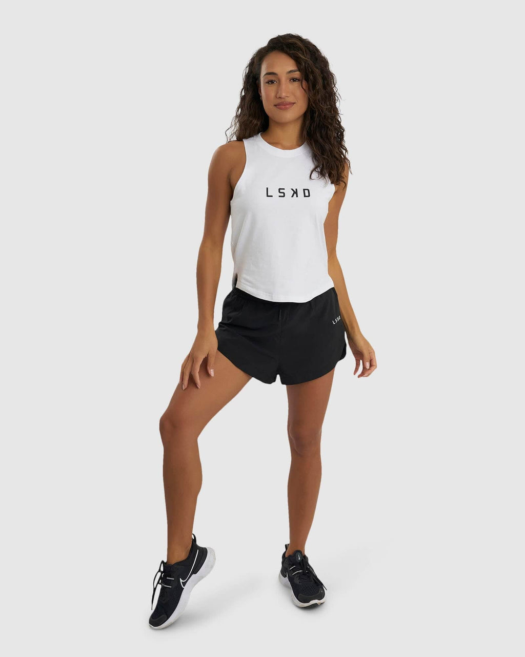Model wearing Power FLXDRY Performance Tank - White